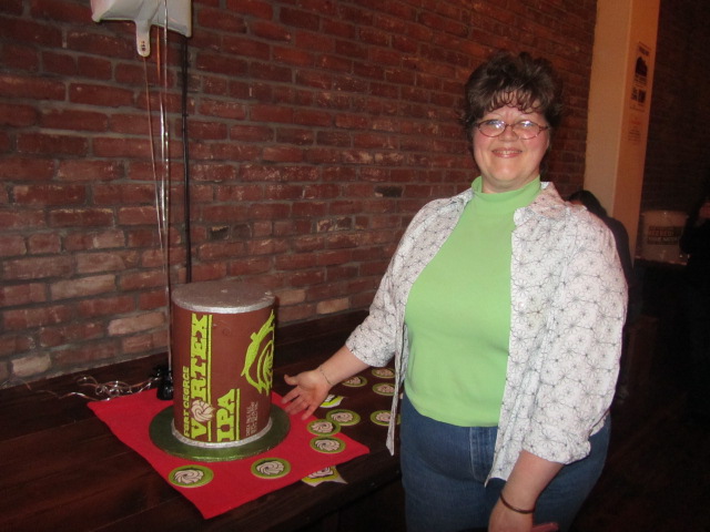 Saraveza's Lori Adams Clinton aka Sugar Pimp with her handmade Fort George Vortex can cake