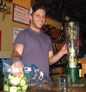 Breakside Brewery's Ben Edmunds loads a randall with cucumbers and juniper berries