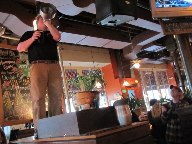 Portland Rock Bottom Brewmaster Charlie Hutchins address the crowd while brewer Bolt Minister looks on
