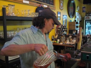 Publican Sean Campbell fill a yard glass at The BeerMongers' 4th of July party