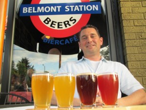 Jeremie Landers sits out from of Belmont Station's Biercafe with a flight of wild ales