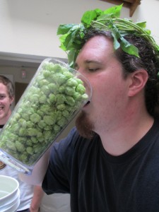Portland U-Brewster Aaron Gillham with some fresh hops that we grew.