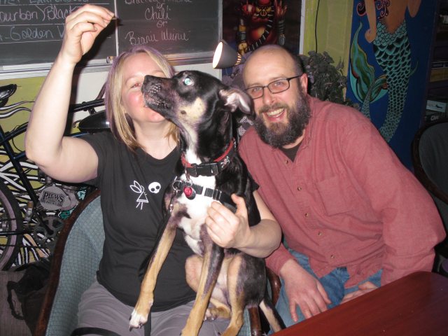 Heather Egizio and Trevor Thurston w/ their pup at Plew's Brews