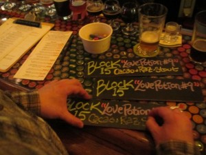 Saraveza's Jonathan Carmean prepares beer signage for My Beery Valentine 3