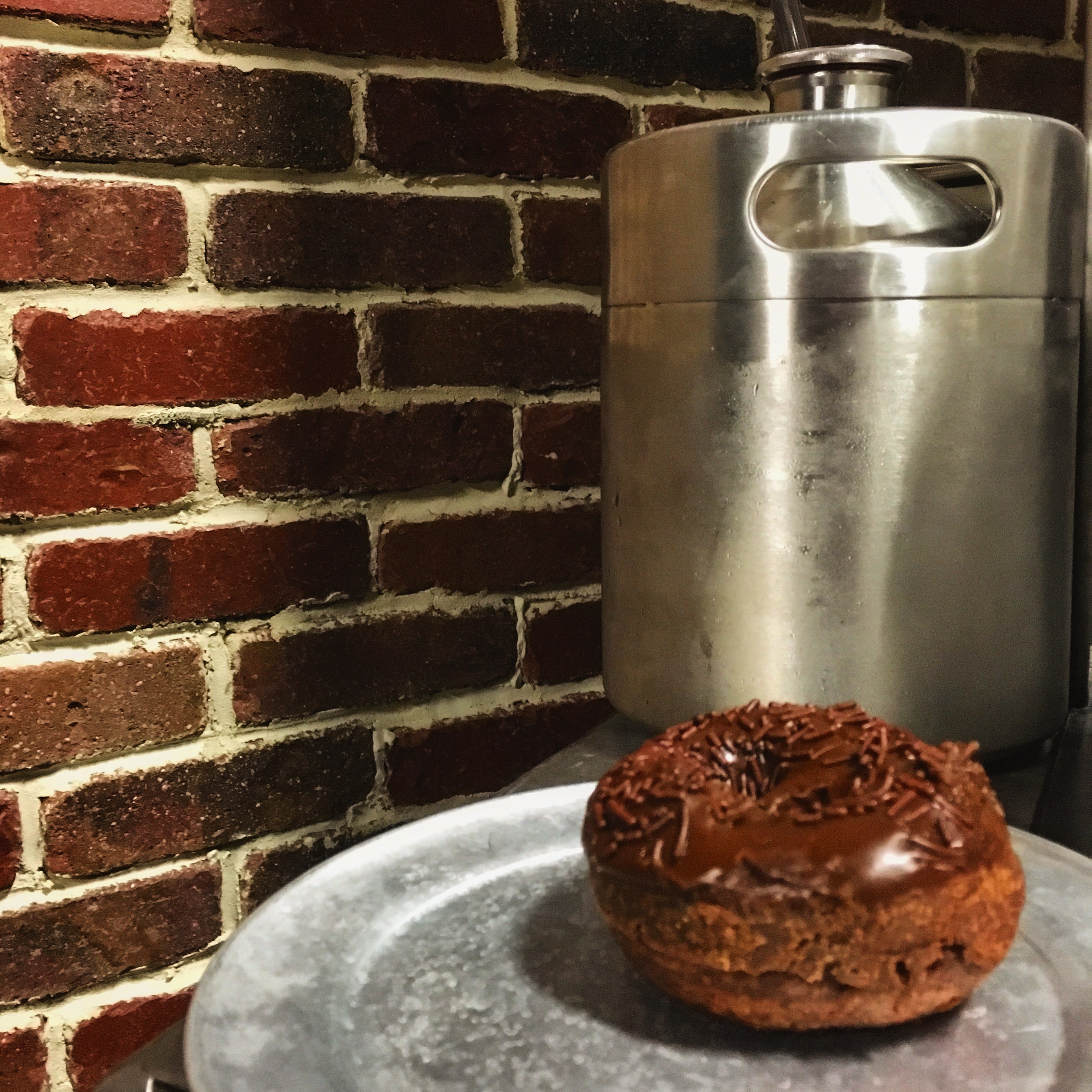 Baker's Dozen doughnut and a growler from Stung Fermented.