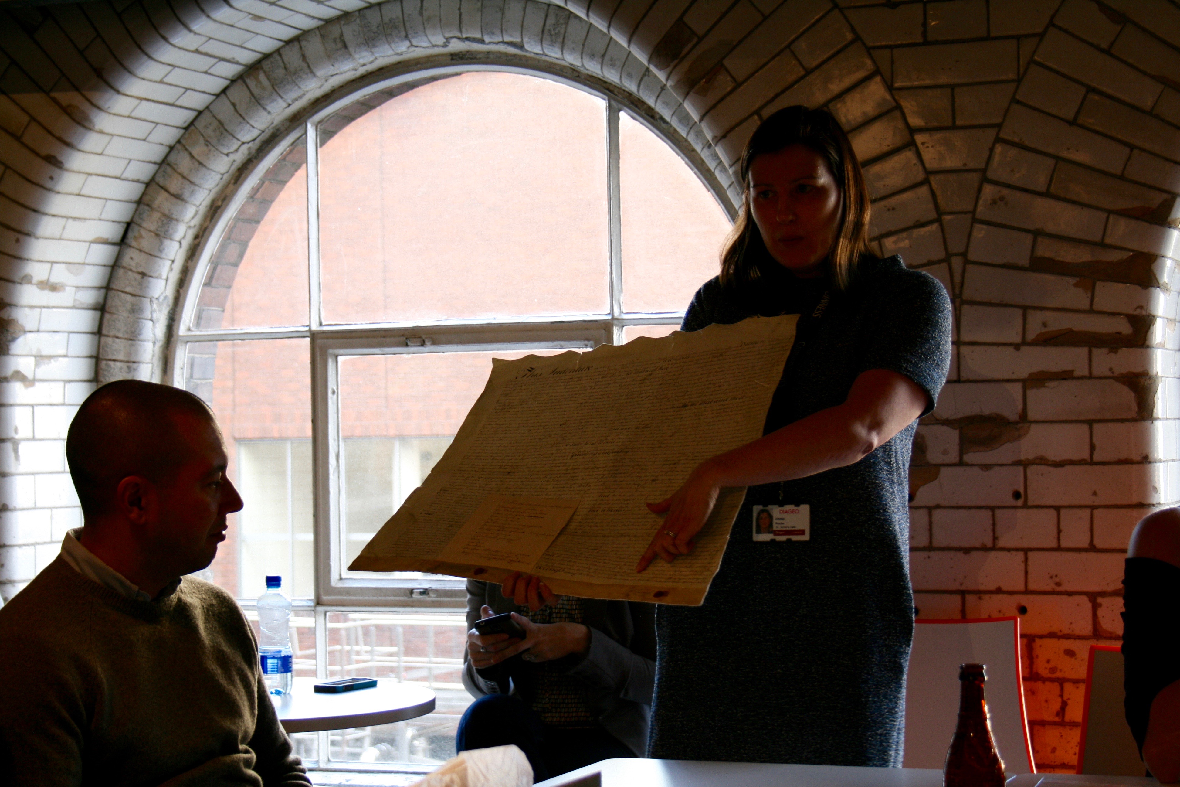 Guinness Archivist, Eibhlin Colgan, showing the famous 9,000 Year Guinness lease.