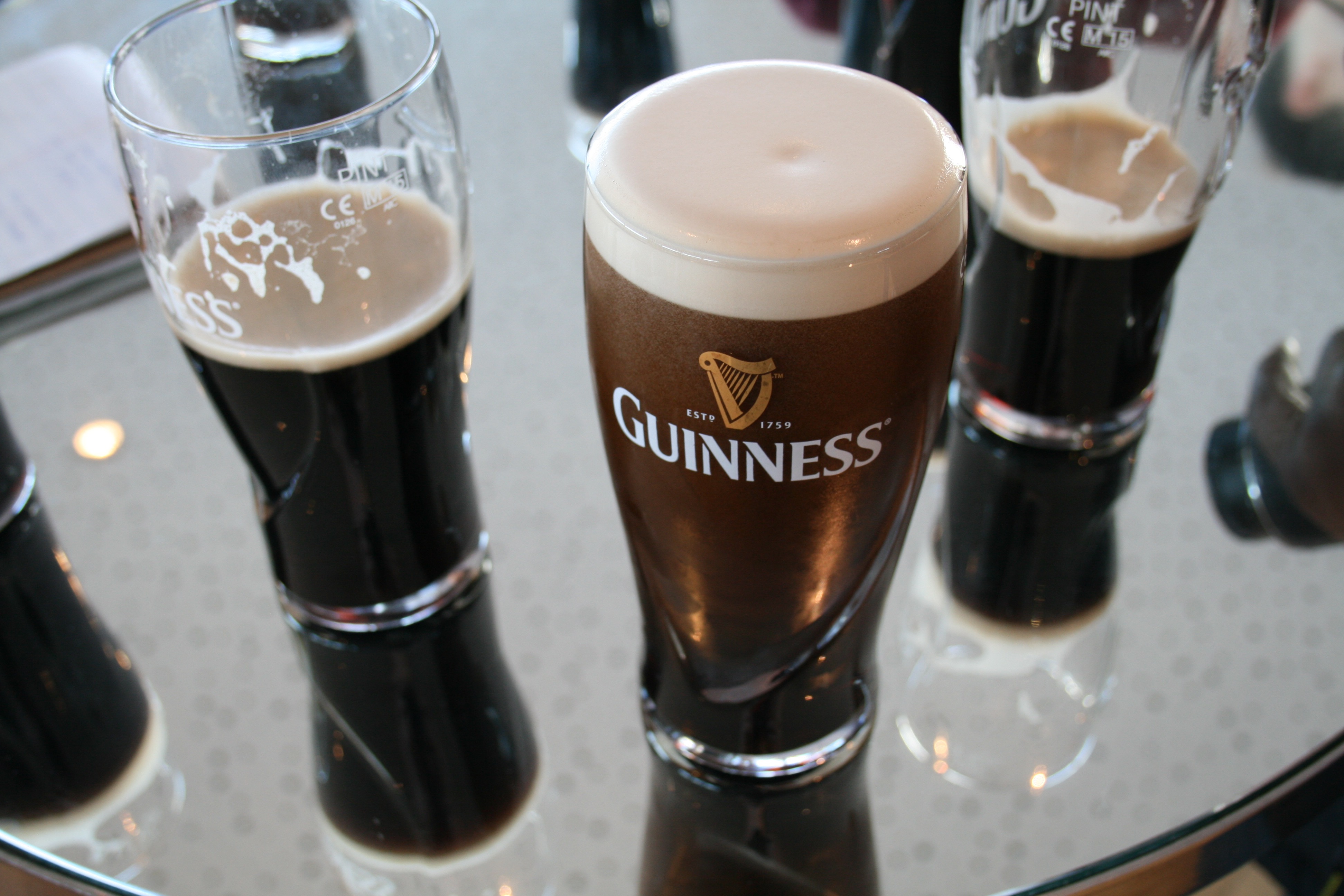 Pints of Guinness at the Gravity Bar atop the Guinness Storehouse in Dublin, Ireland..