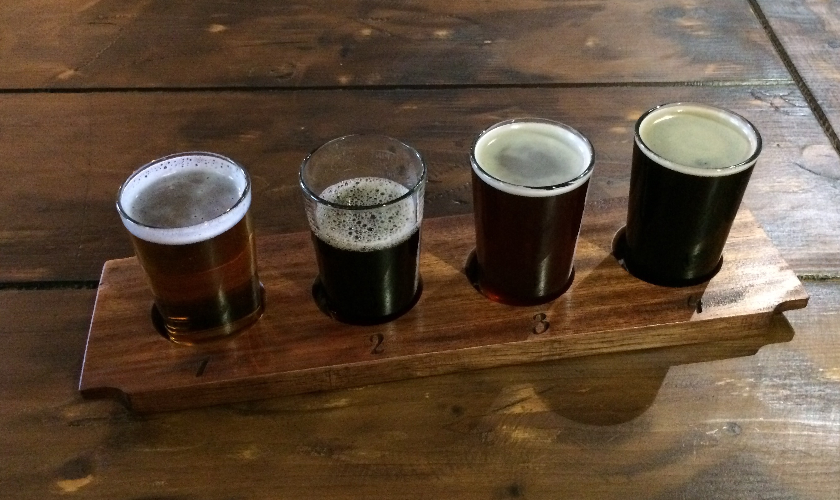 Taster tray at The Open Gate Brewery at St. James's Gate. Tray consisted of Smithwicks Blonde Ale, OGB Barrel Beer, OGB Imperial Dunkel Weisse, and OGB Milk Stout while on a trip to Guinness.