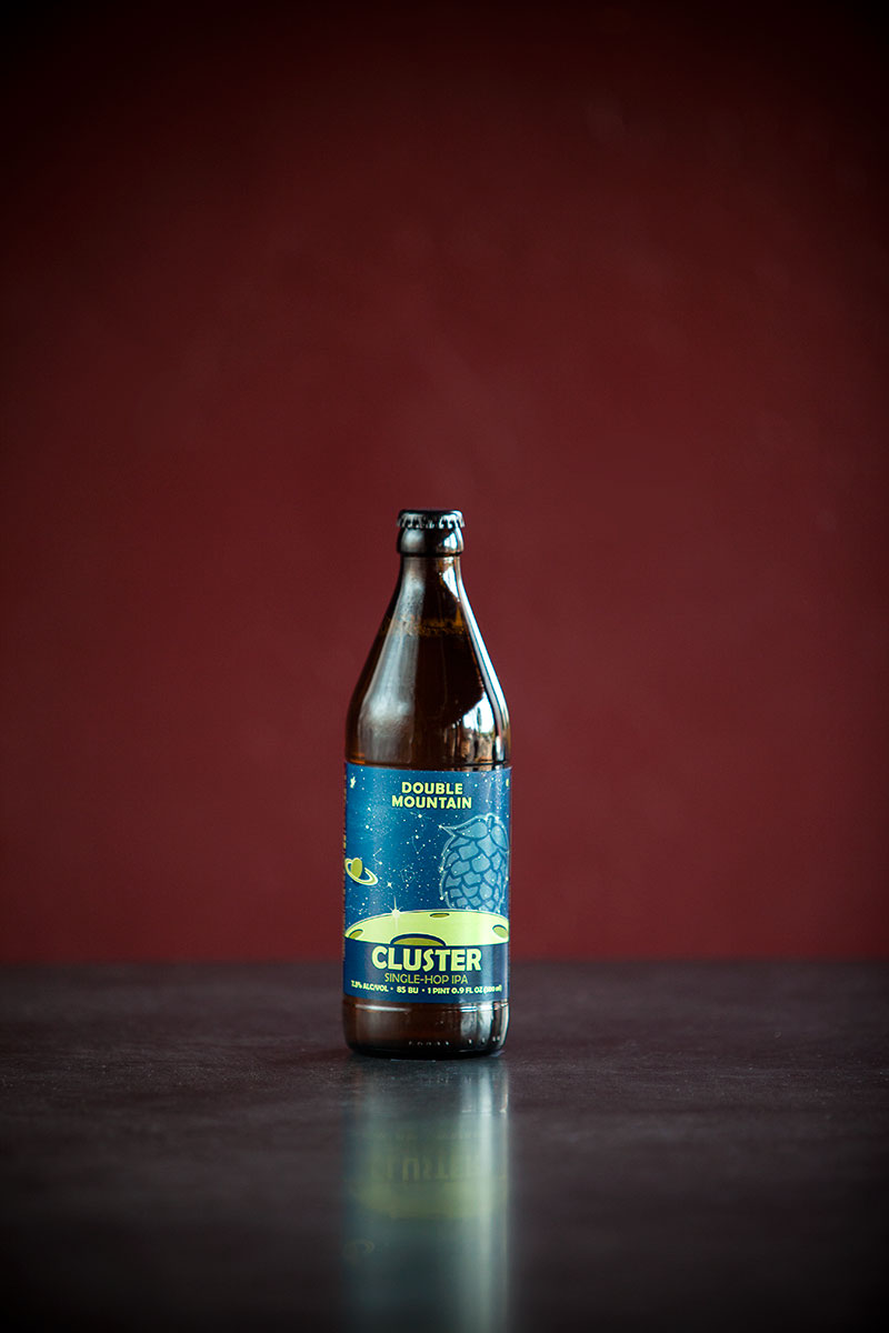 A bottle of Double Mountain Cluster Single Hop IPA. (image courtesy of Double Mountain Brewery)