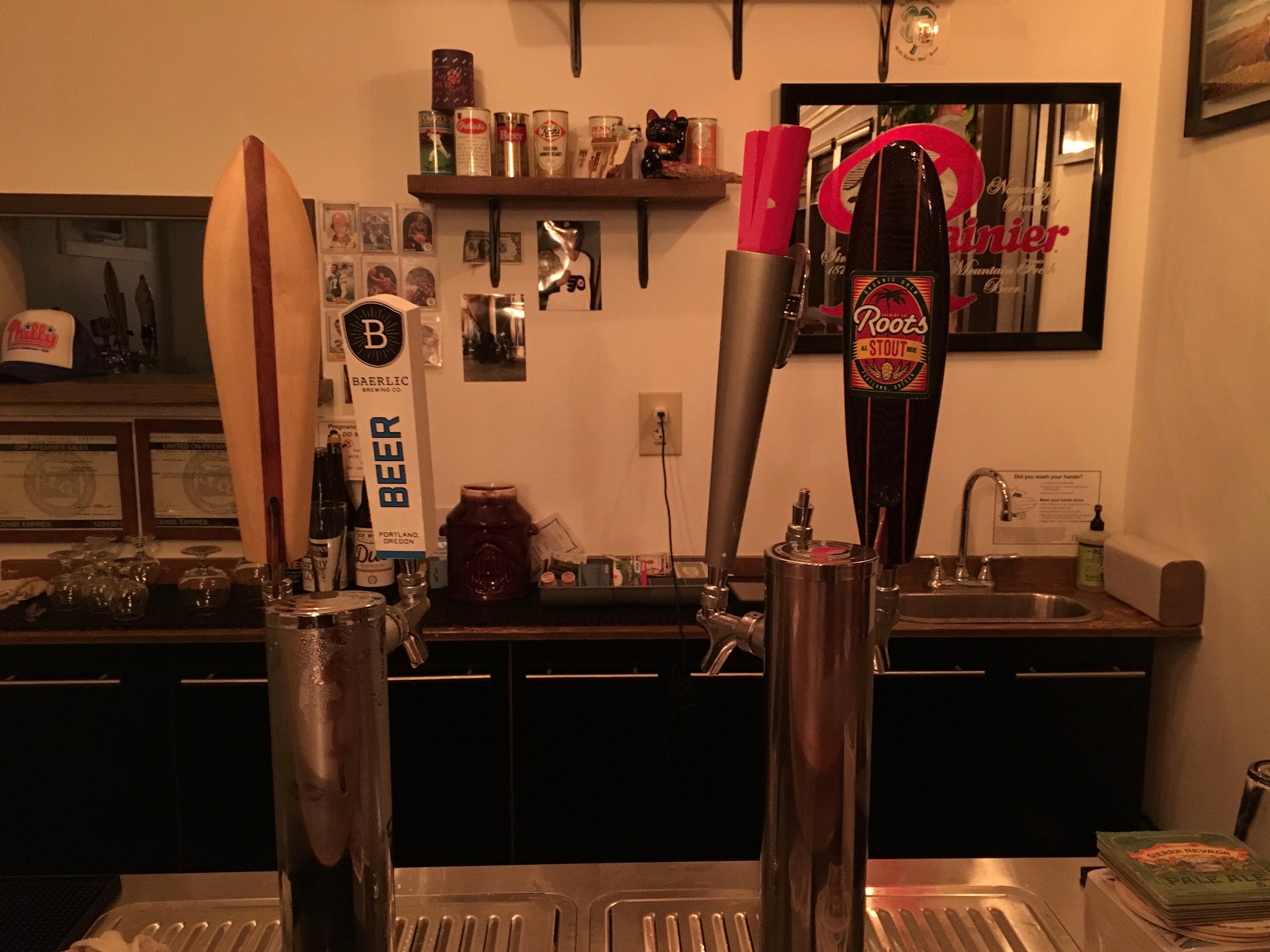 Brian Koch shows his roots in the Portland beer business with some vintage Roots Brewing tap handles.