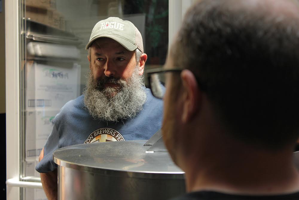 Longtime Rogue Brewmaster John Maier discussing his brew with the Green Dragon Brew Crew. (photo courtesy of Rogue Ales)