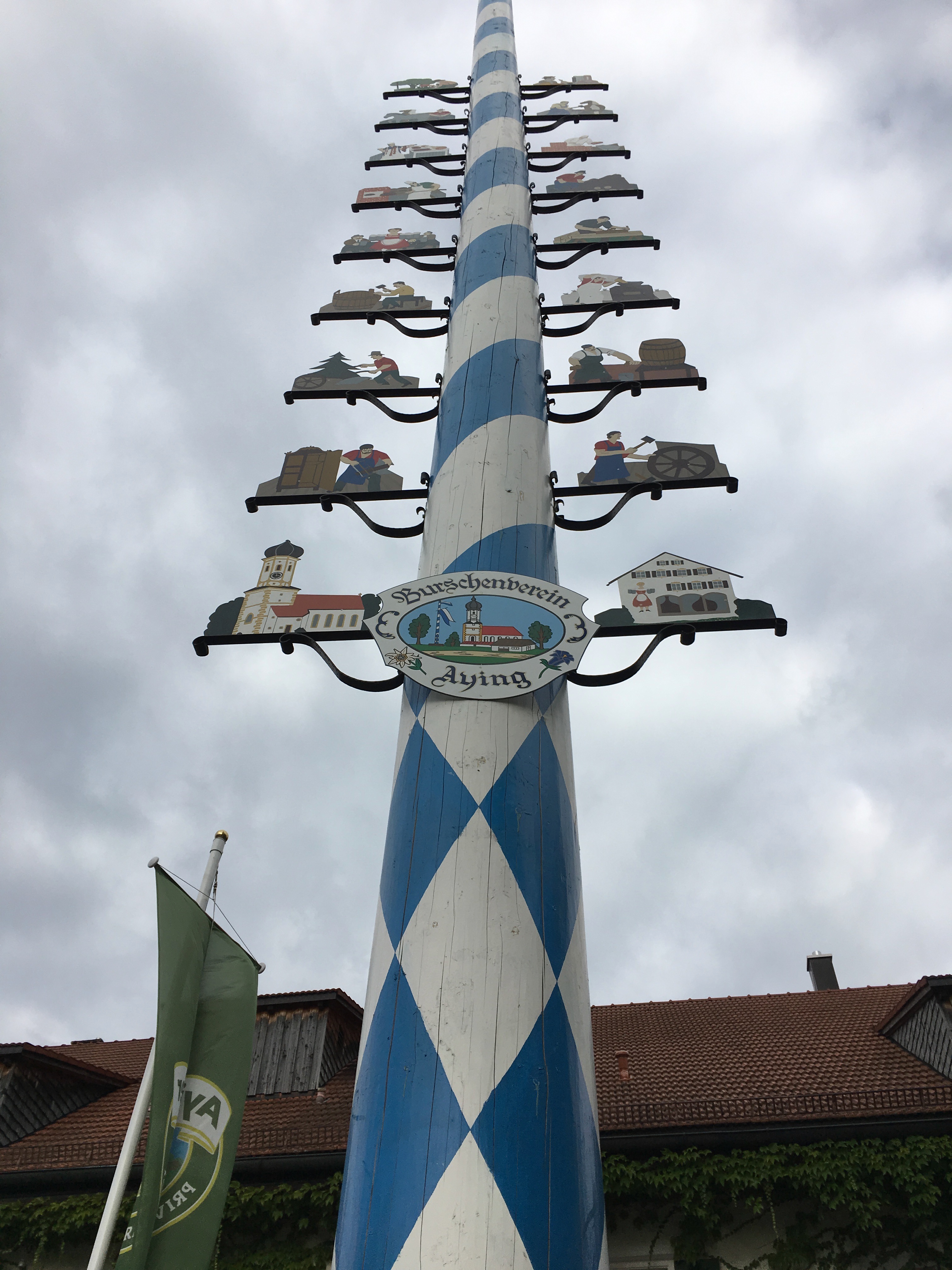 A maypole in front of Brauereigasthof Hotel Aying.