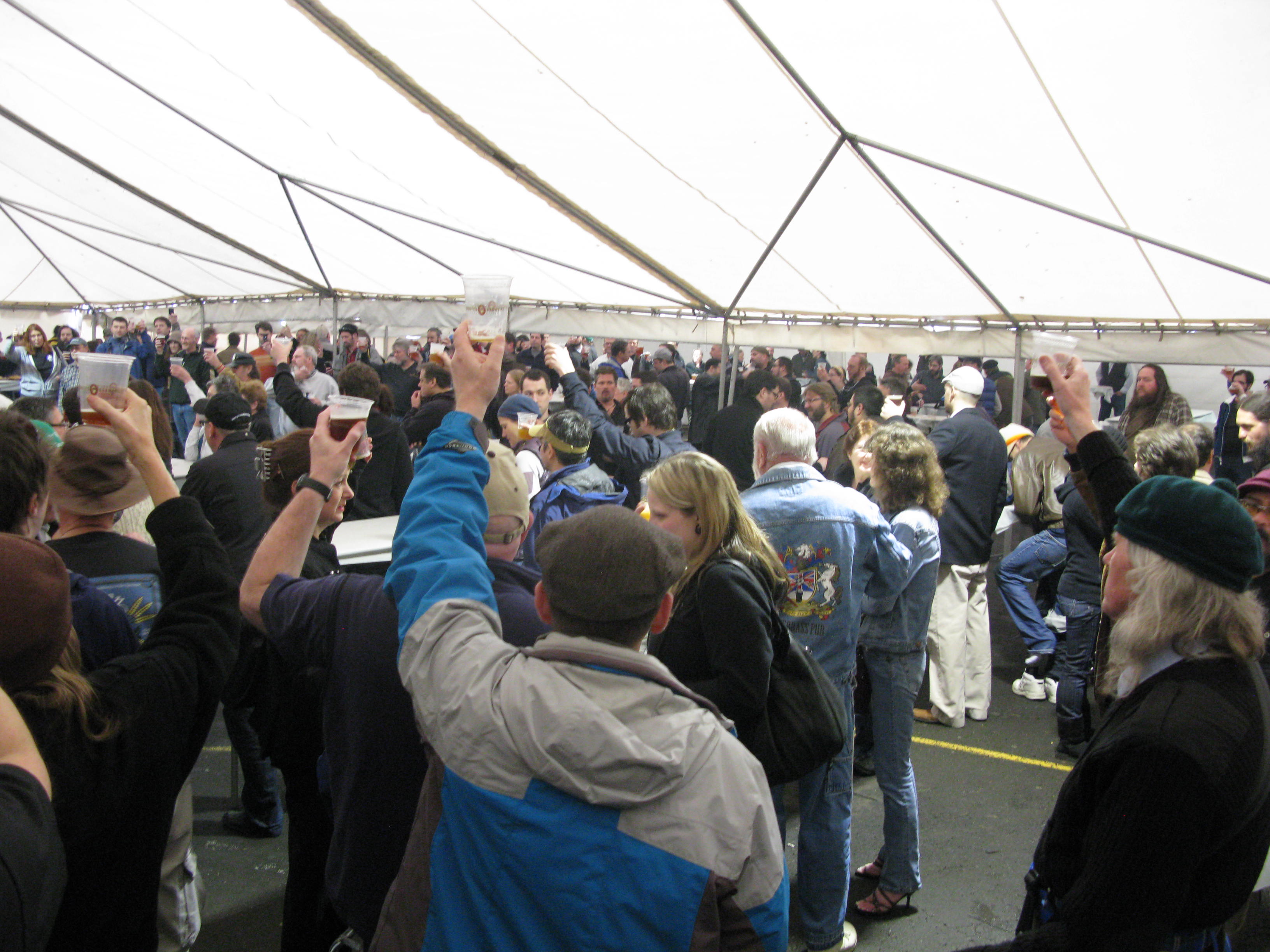 Don Younger's memorial was so big that it was held in a tent in the back parking lot of the Horse Brass, where this foto was taken during the main toast to Don,  the old Tavern Rat himself...(FoystonFoto)