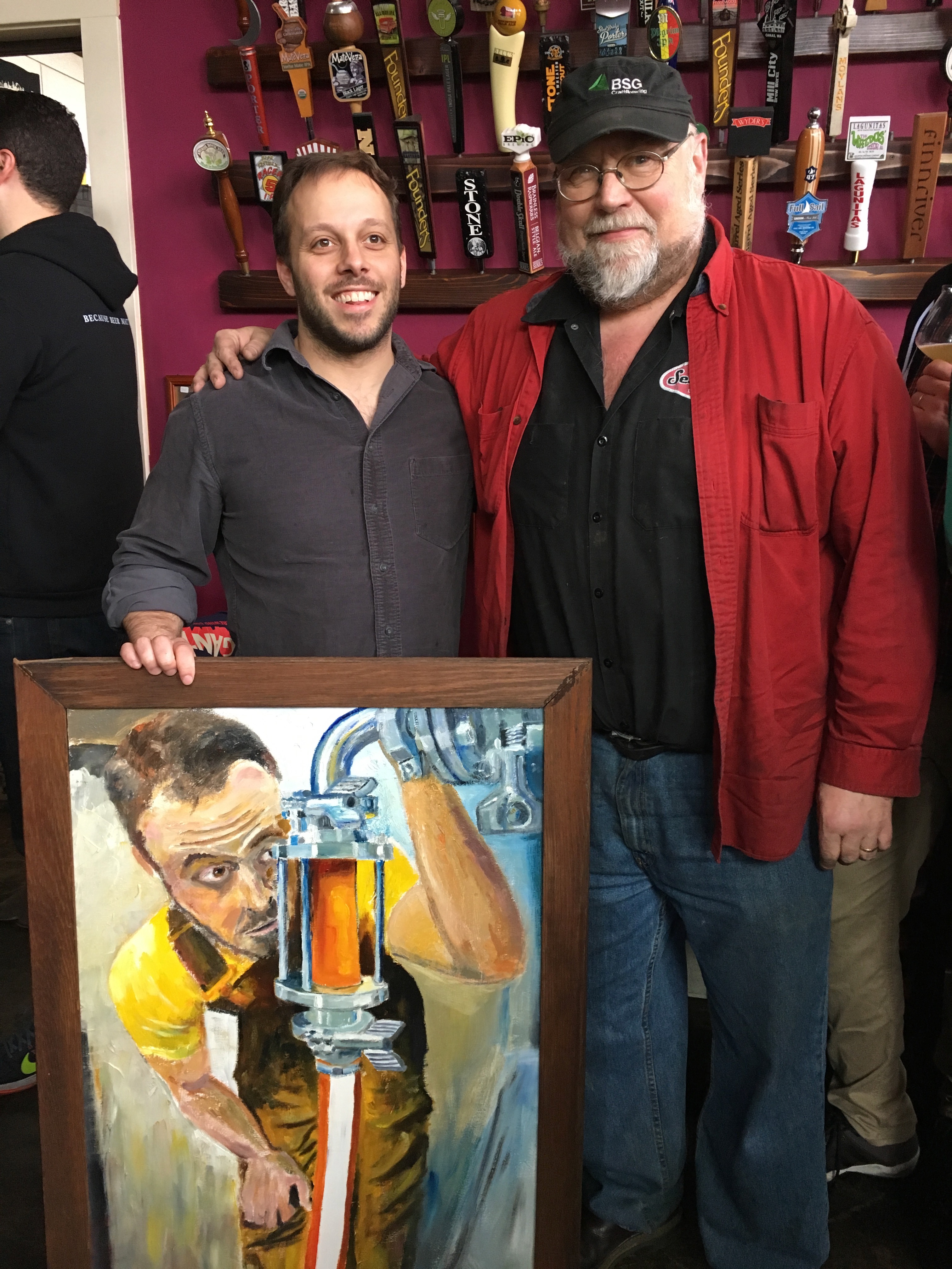 John Foyston presents Ben Edmunds with a portrait that John painted a few years back at Belmont Station's 20th Anniversary.