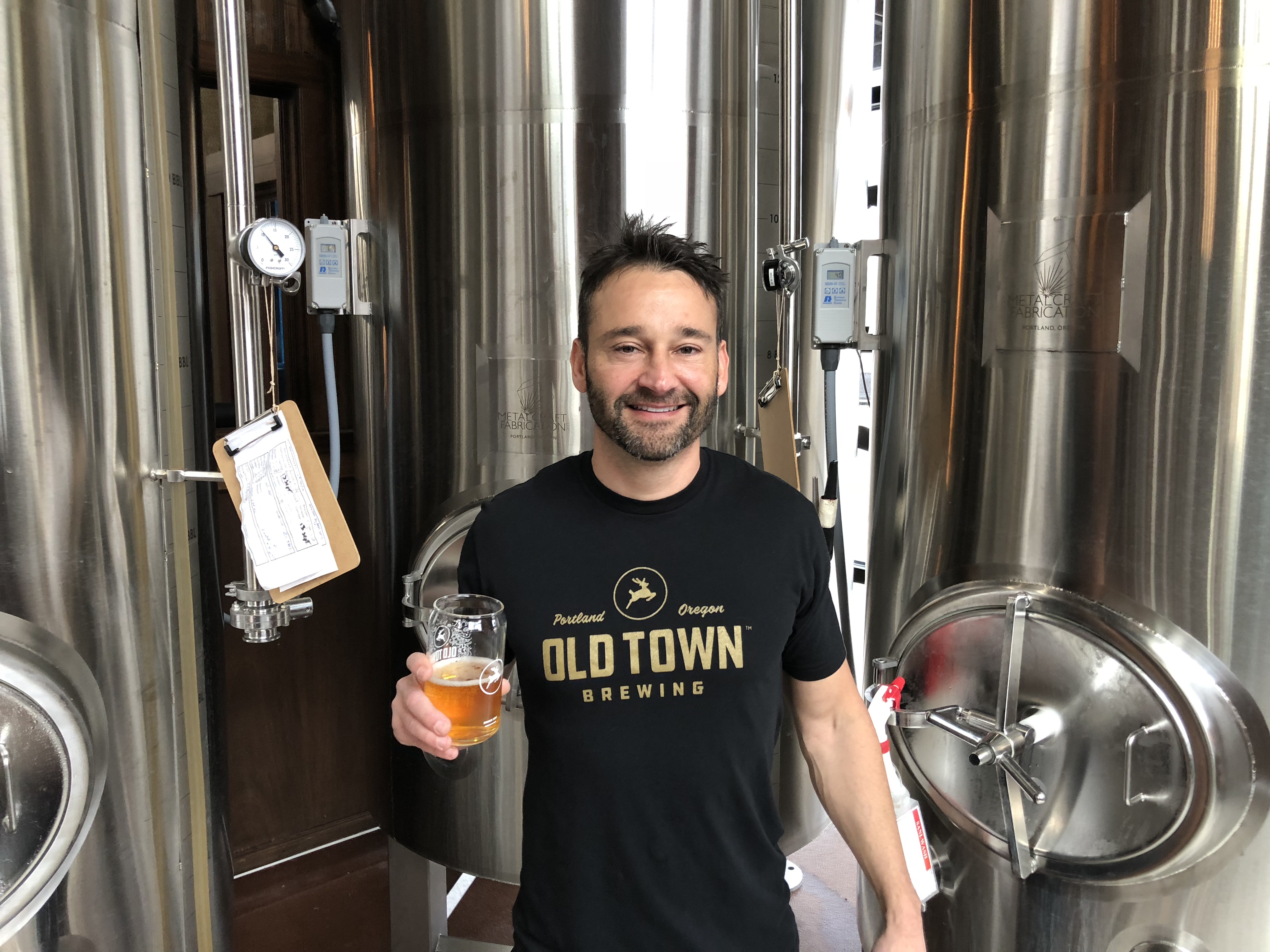 Adam Milne from Old Town Brewing at his brewery in Northeast Portland. He continues his trademark fight with the City of Portland. The city wants to market Old Town's trademarked Stag Logo to other alcohol producers. Shame on you Portland.