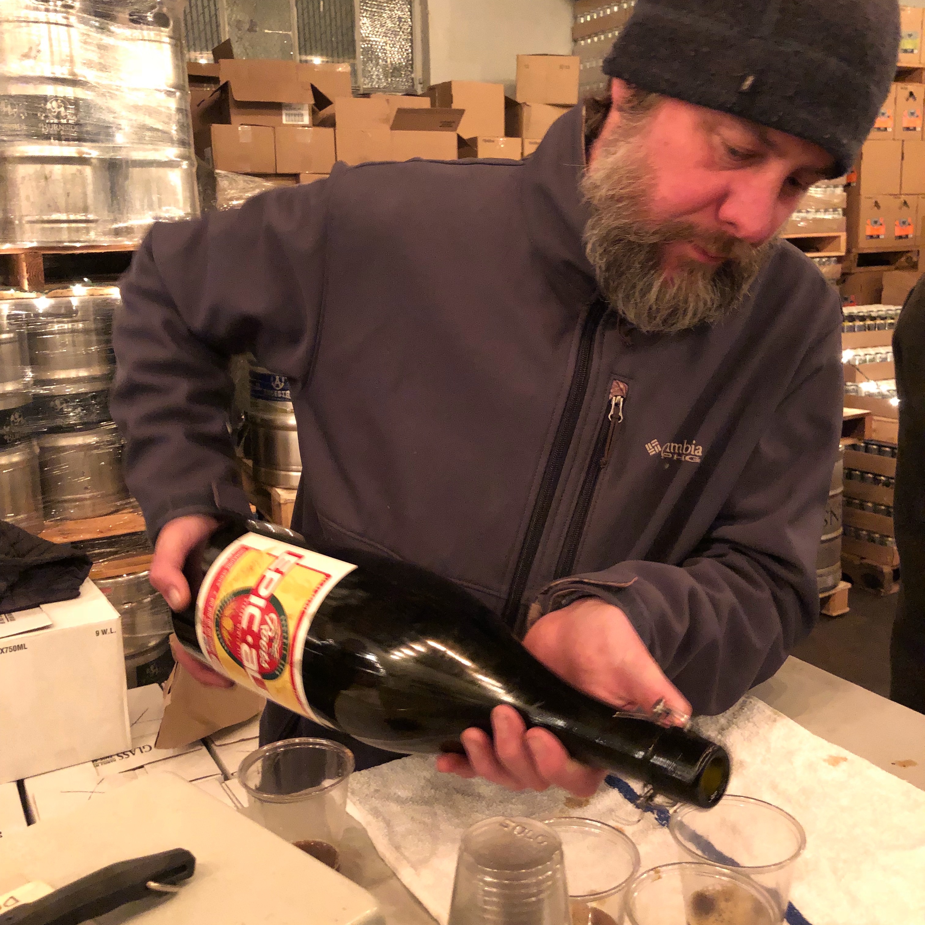 Chip Conlon pours from a 2005 Roots Epic at the Burnside Brewing Holiday Party.