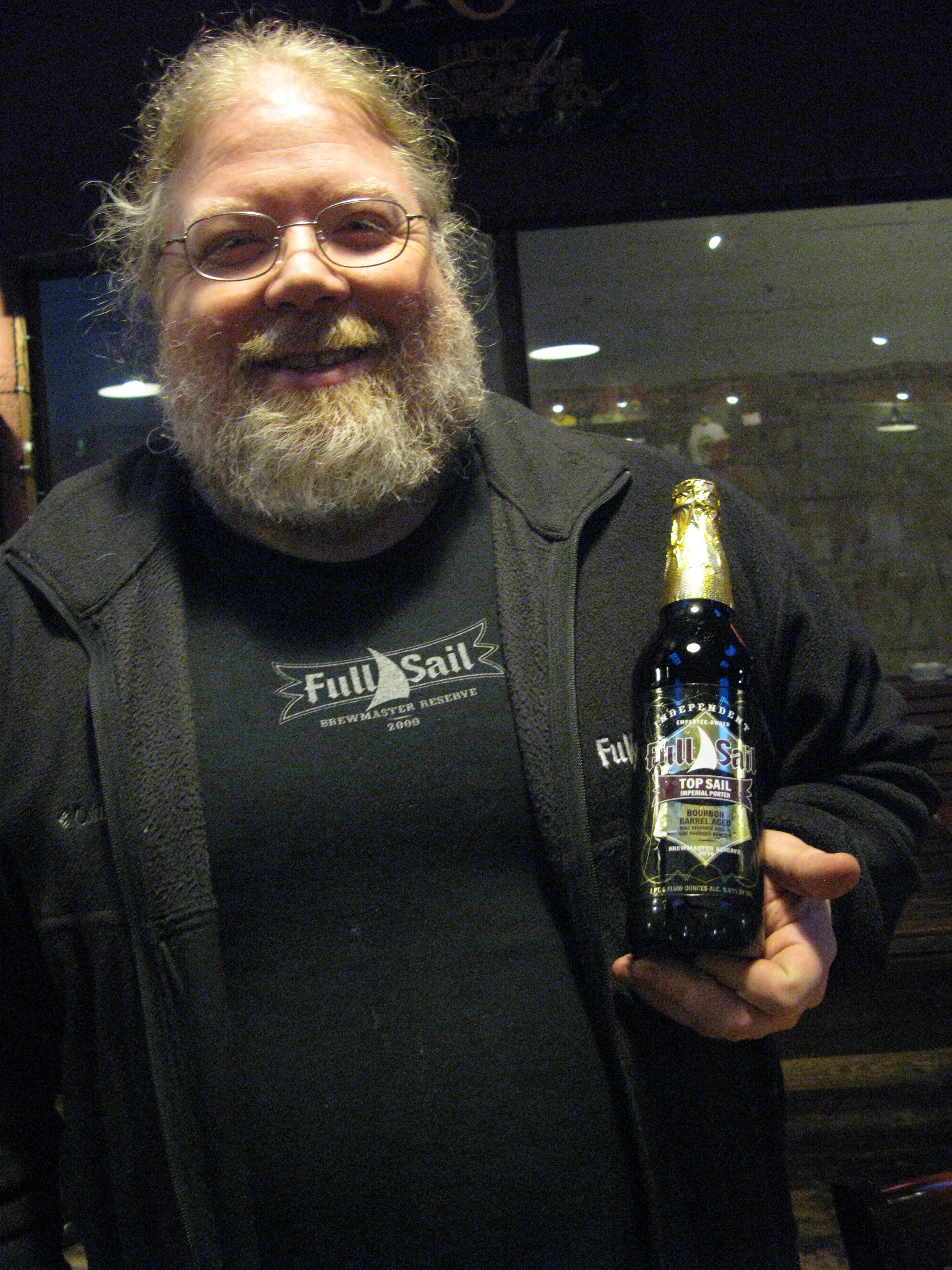 John Harris holding a bottle of Full Sail Top Sail. (FoystonFoto)