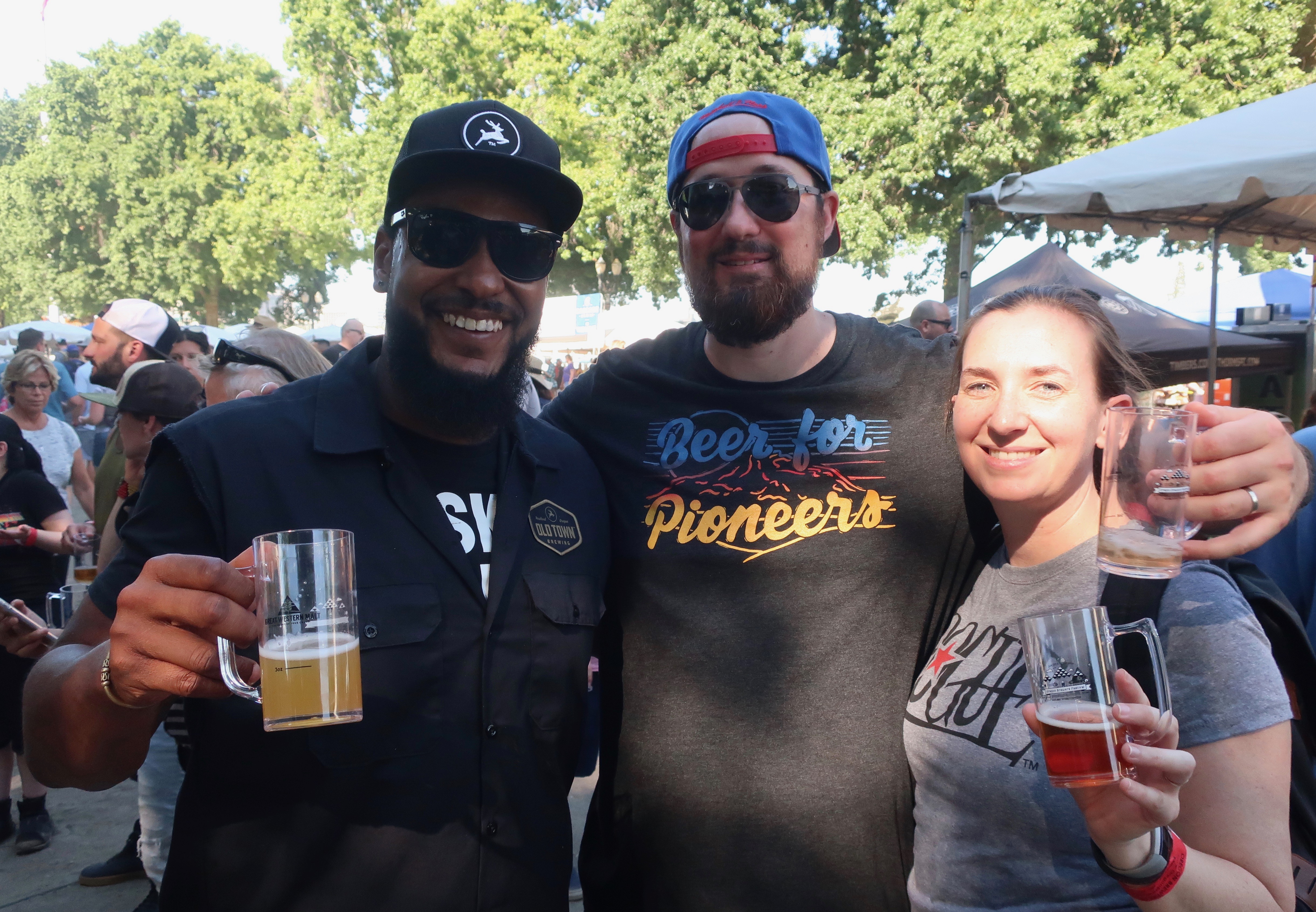 Joe Sanders from Old Town Brewing, Adam Sivits from Oregon City Brewing and Clare Goggin Sivits from Rogue Ales at the 2018 Oregon Brewers Festival.