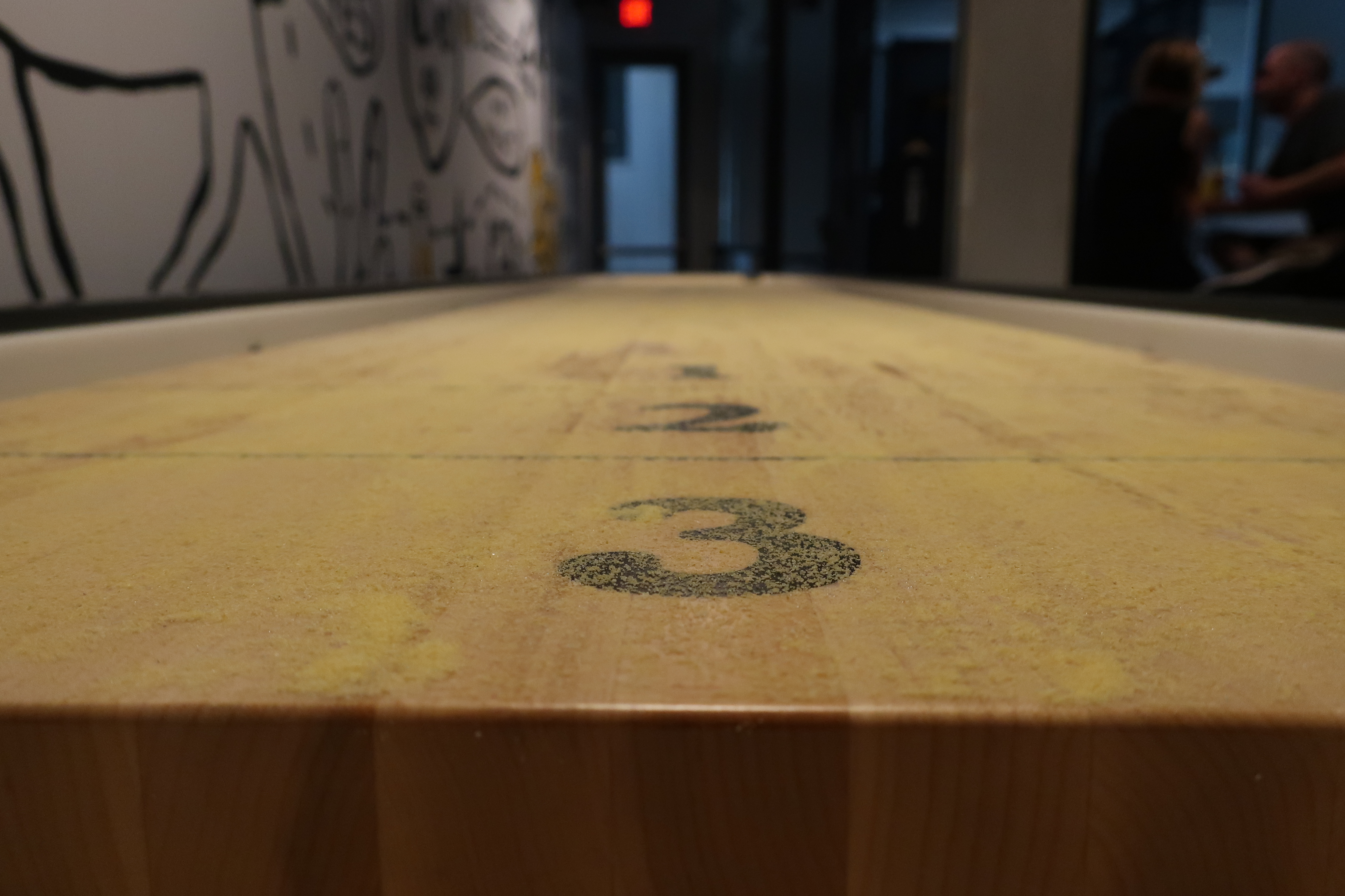 The shuffleboard is free to play at West Coast Grocery Co.