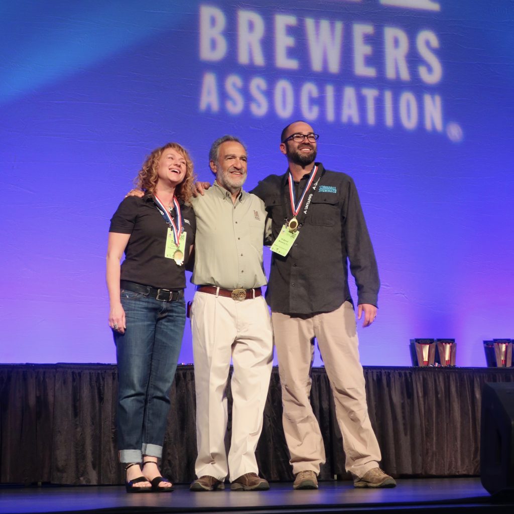 Tonya Cornett and Ian Larkin of 10 Barrel Brewing on stage for their 2nd GABF Medal at the 2018 Great American Beer Festival.