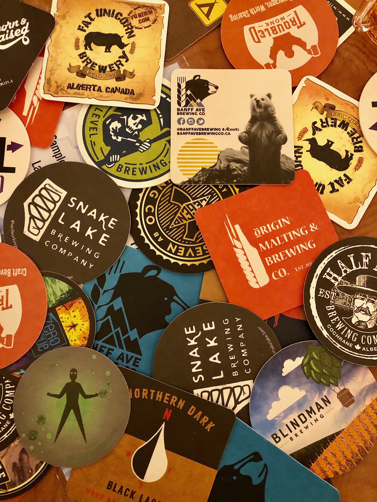 Assorted coasters at the Banff Craft Beer Festival.