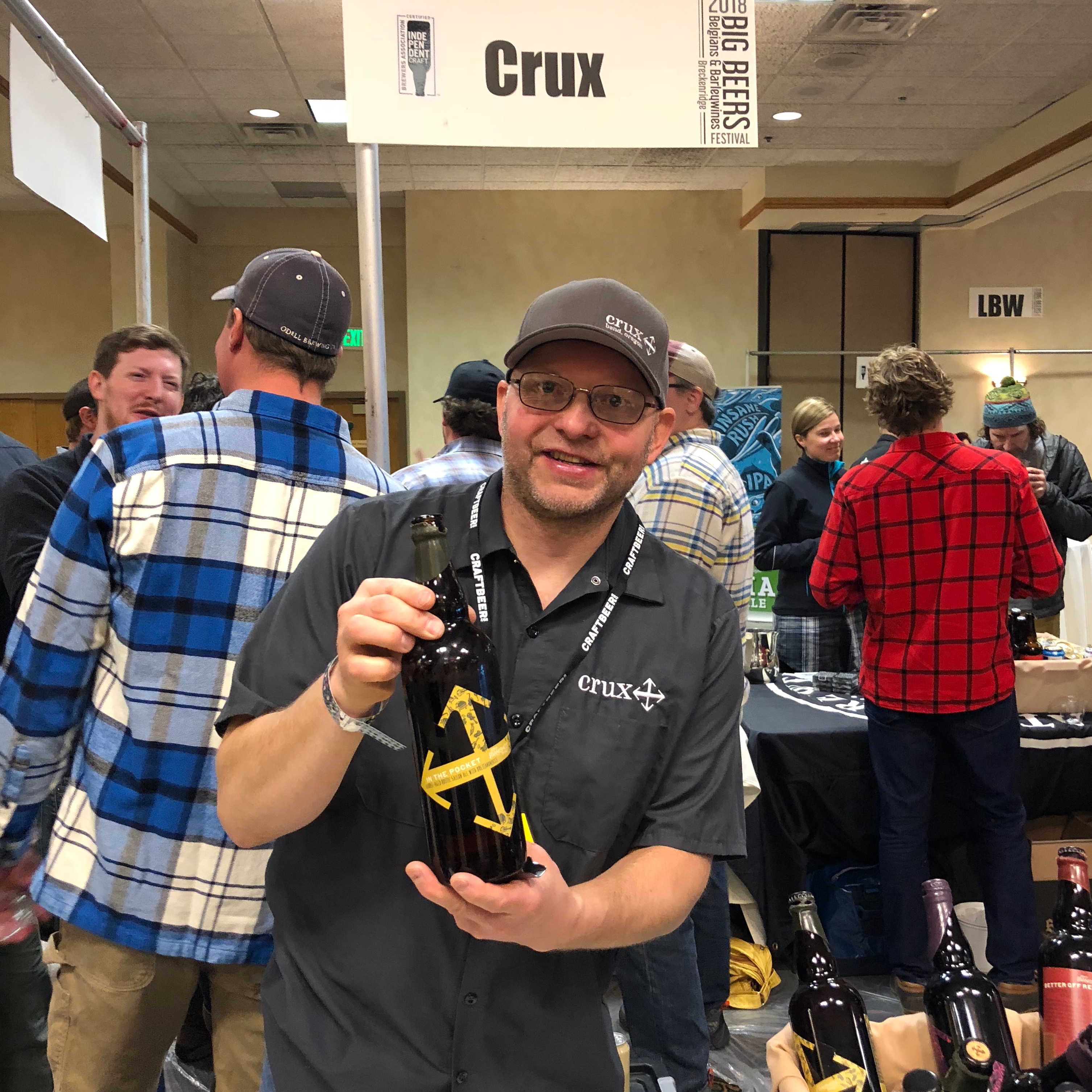 Cam O'Connor from Crux Fermentation Project pouring at the 2018 Big Beers, Belgians & Barleywines Festival.
