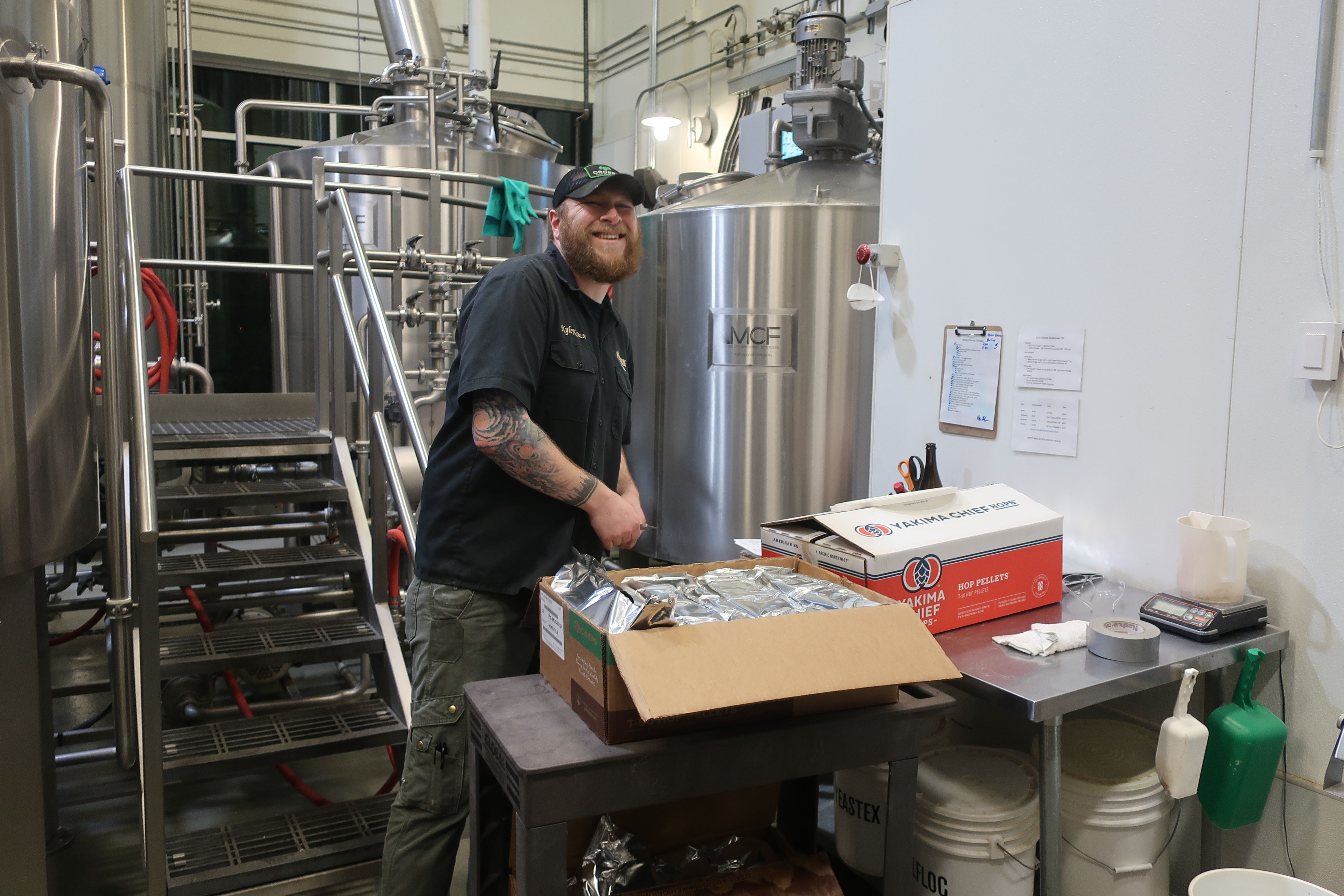 pFriem Family Brewers brewer Kyle Krause brewing during our evening brewery tour.