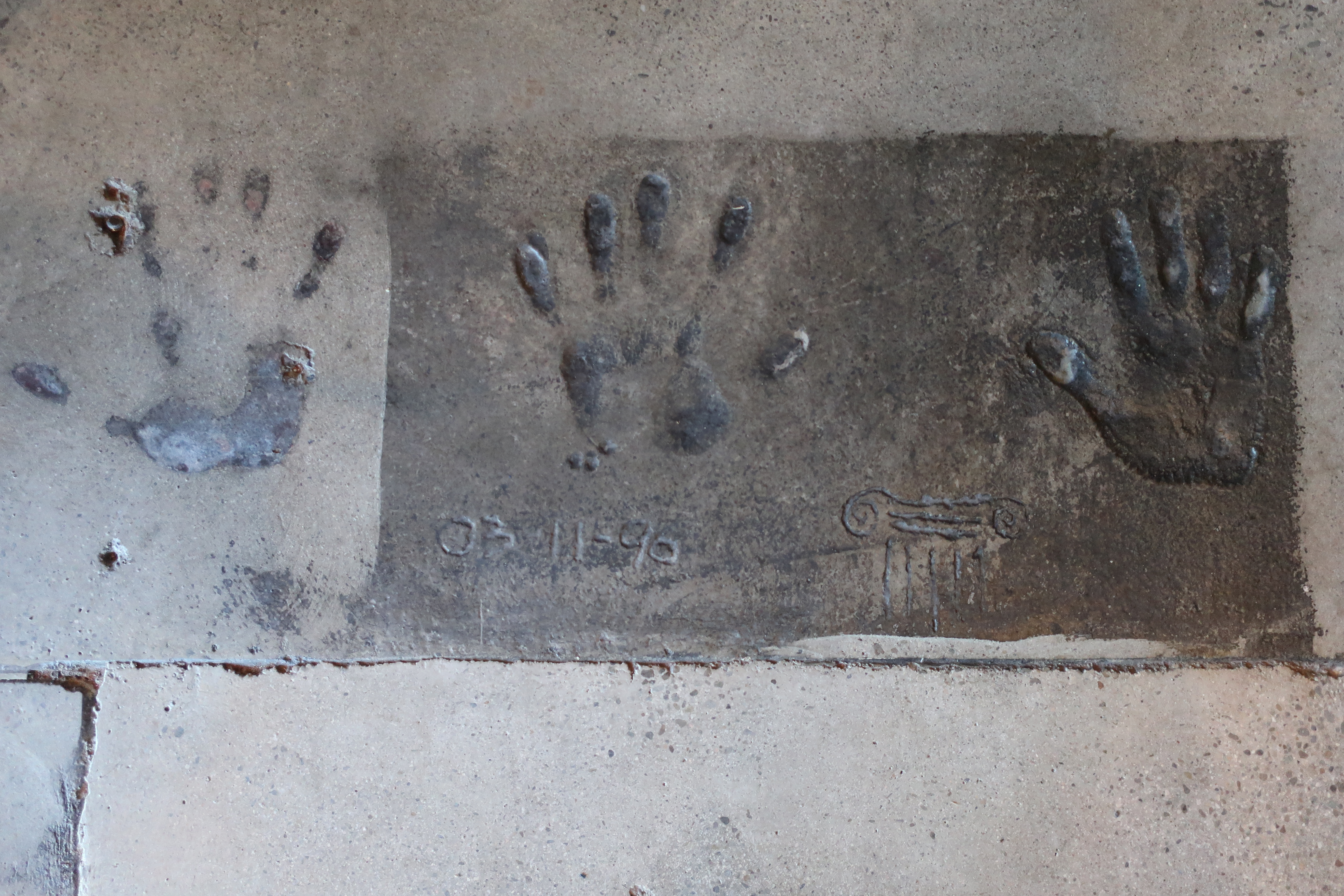 The three handprints in concrete of Dave Buhler, Joe Bisacca, and Dick Cantwell, Elsyian Brewing co-founders remains at the remodeled Elysian Brewing - Capitol Hill.