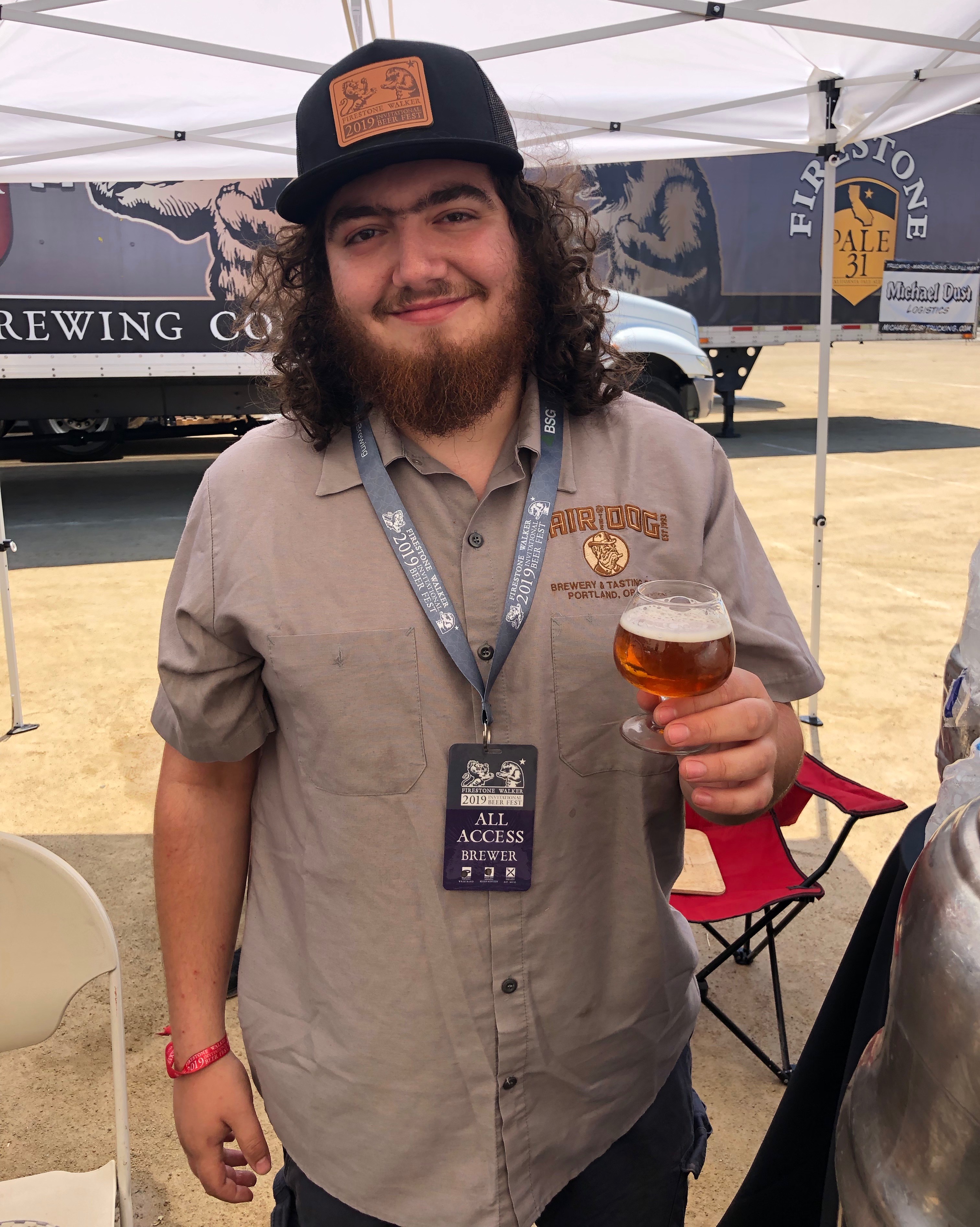 Isaac Sprints pouring for Hair of the Dog Brewing at the 2019 Firestone Walker Invitational Beer Fest.