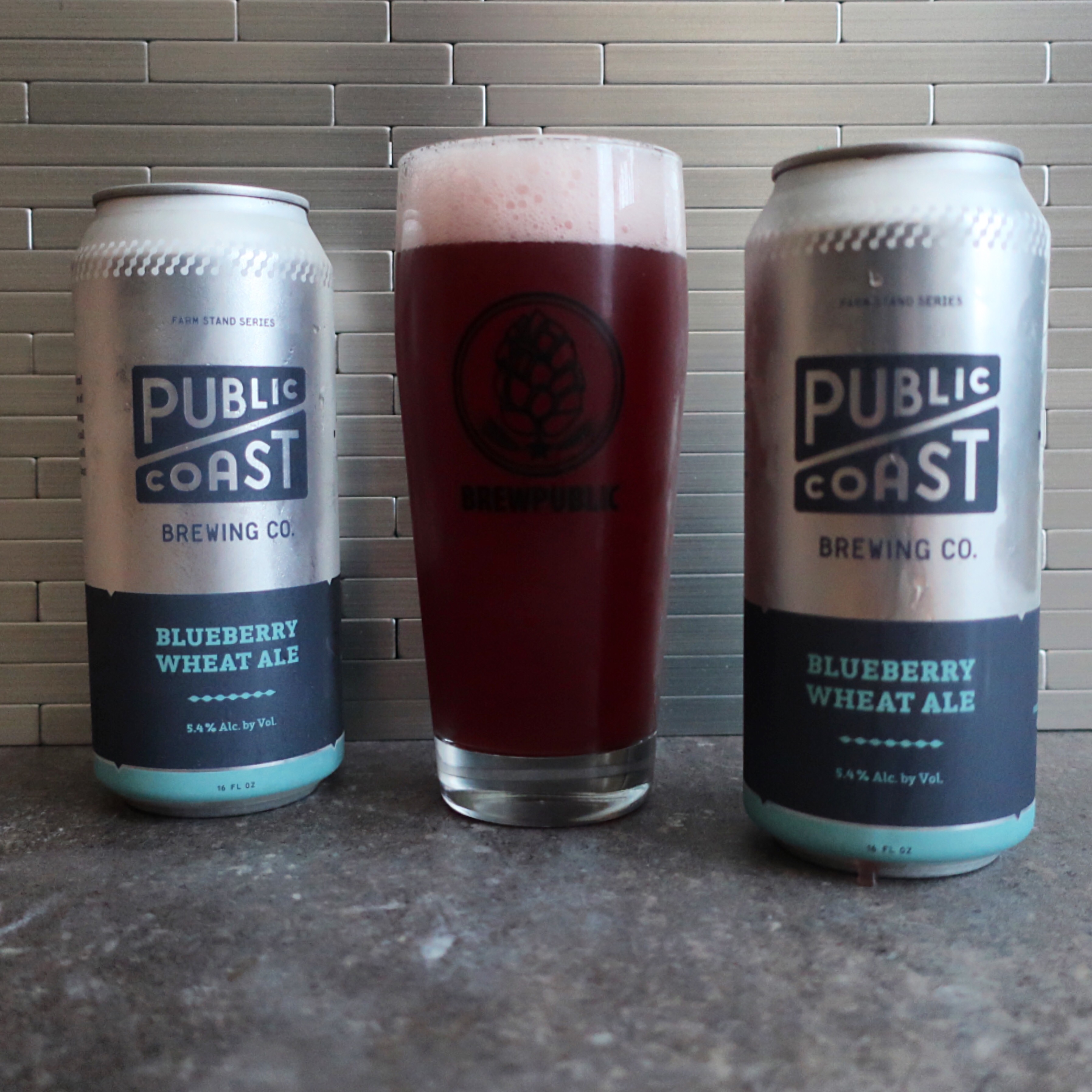 A glass pour of the new Public Coast Brewing Blueberry Wheat Ale.