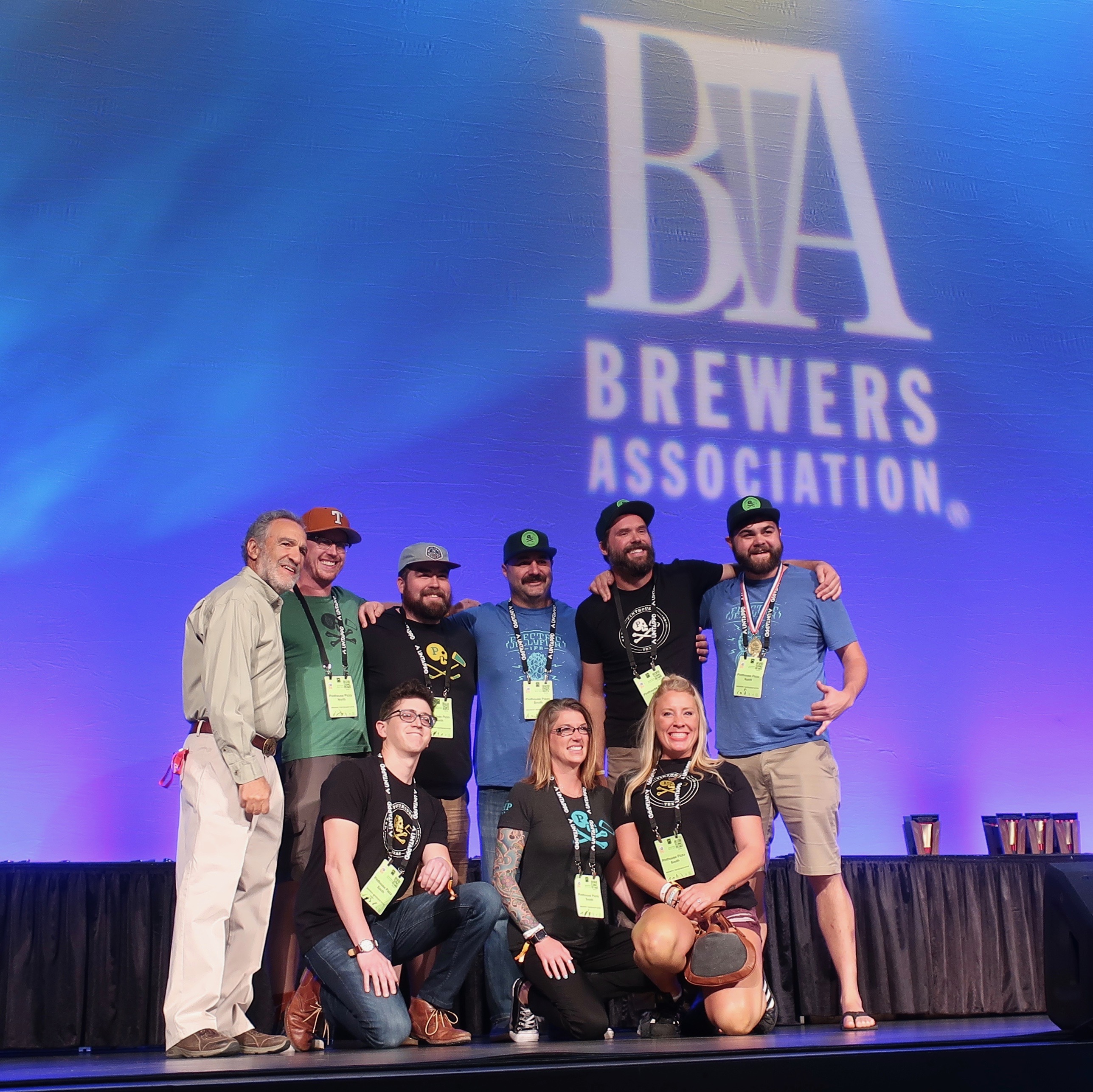 Pinthouse Pizza accepts a Gold Medal at the 2018 Great American Craft Beer Festival for its Green Battles IPA.