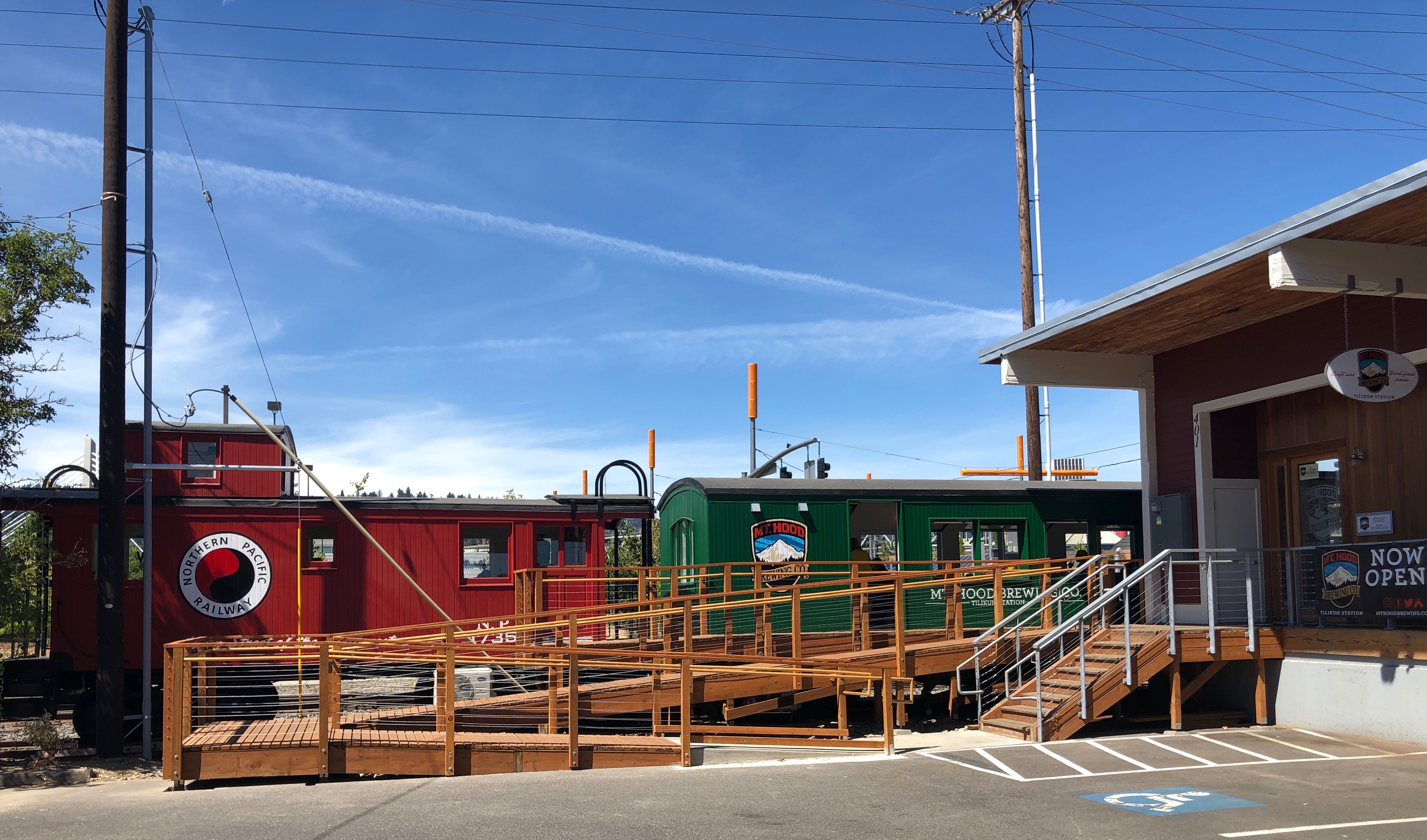 Two train cars offer seating options at Mt. Hood Brewing Tilikum Station.