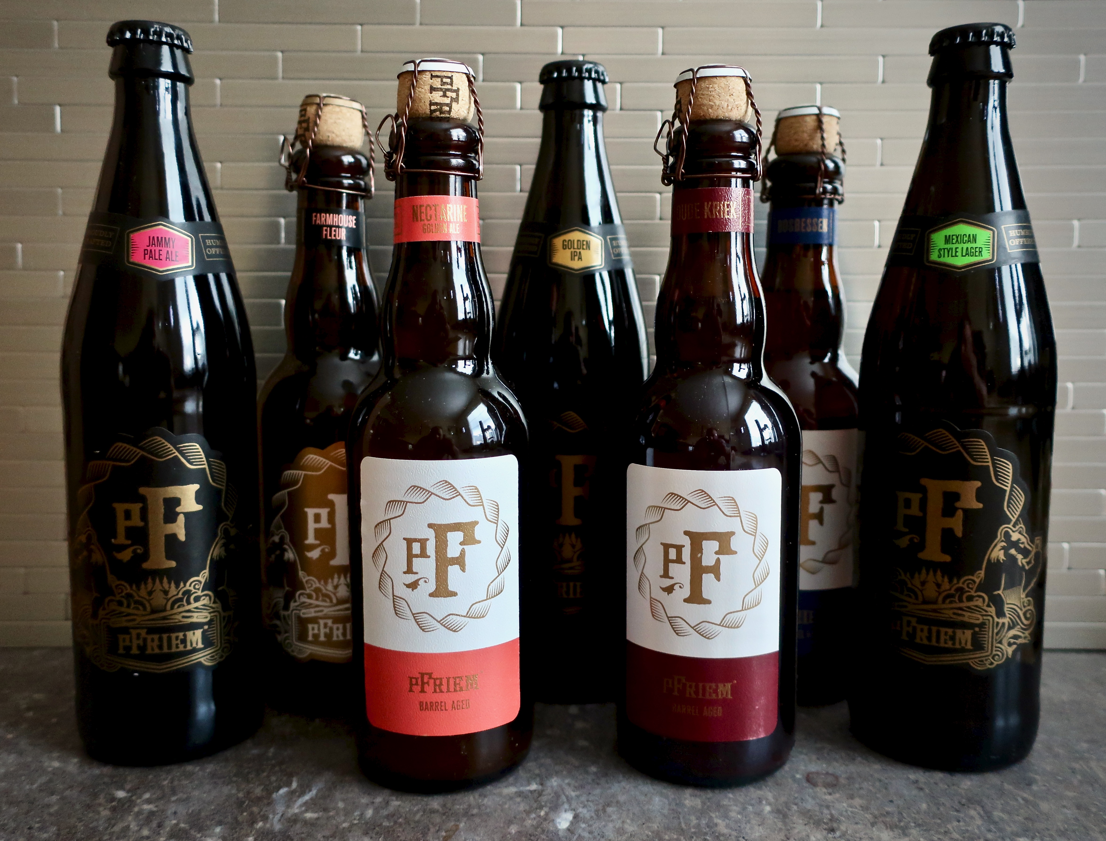 pFriem Family Brewers Summer 2019 Beer Releases - Mexican Lager, Golden IPA, Jammy Pale, Farmhouse Fleur, Nectarine Golden Ale, Bosbessen, and Oude Kriek.