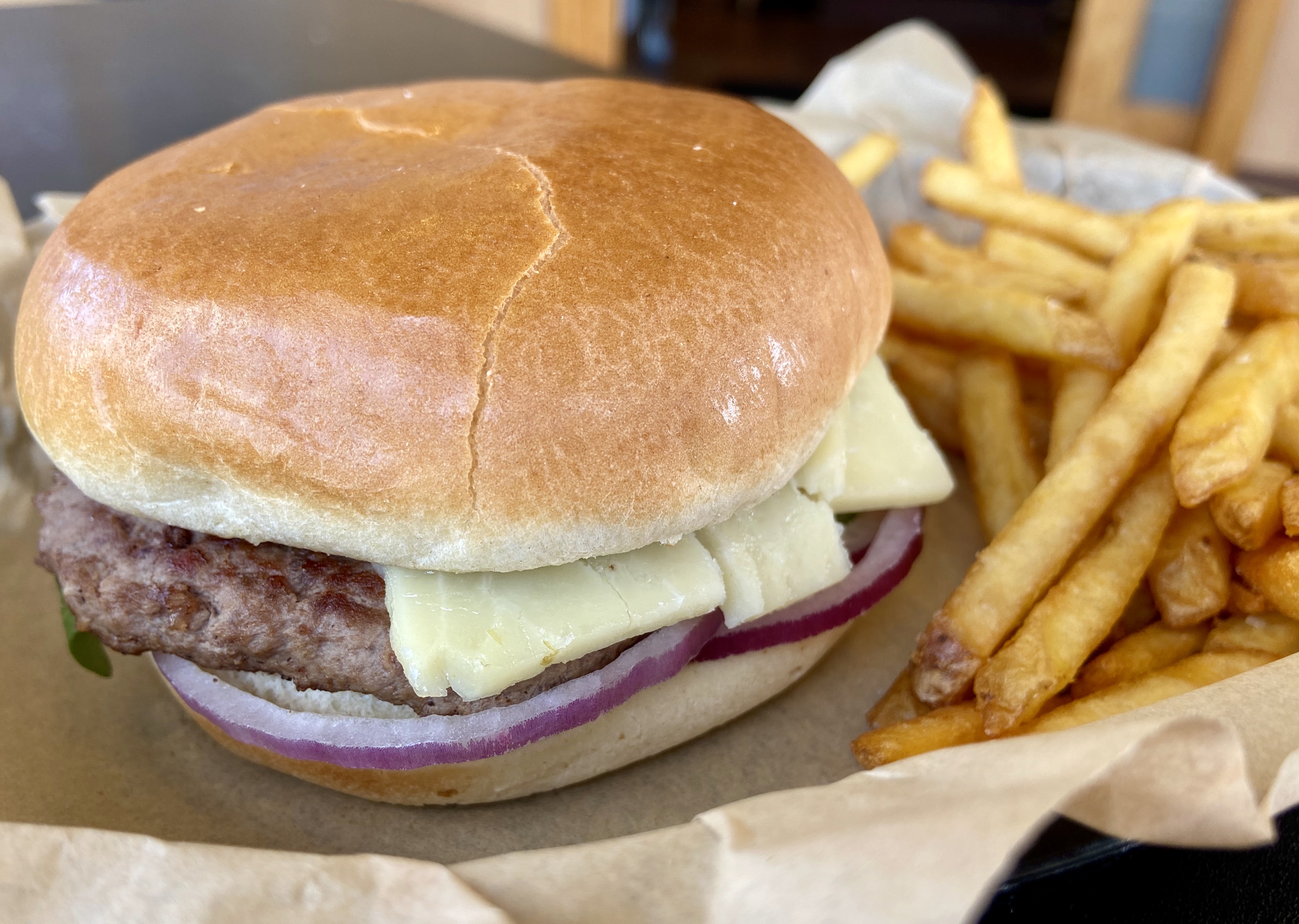 A Hopyard Cheddar Burger made with Rogue Creamery Cheddar and Rogue Farms' Freedom Hop Petals with a side of fries at Burgerville.