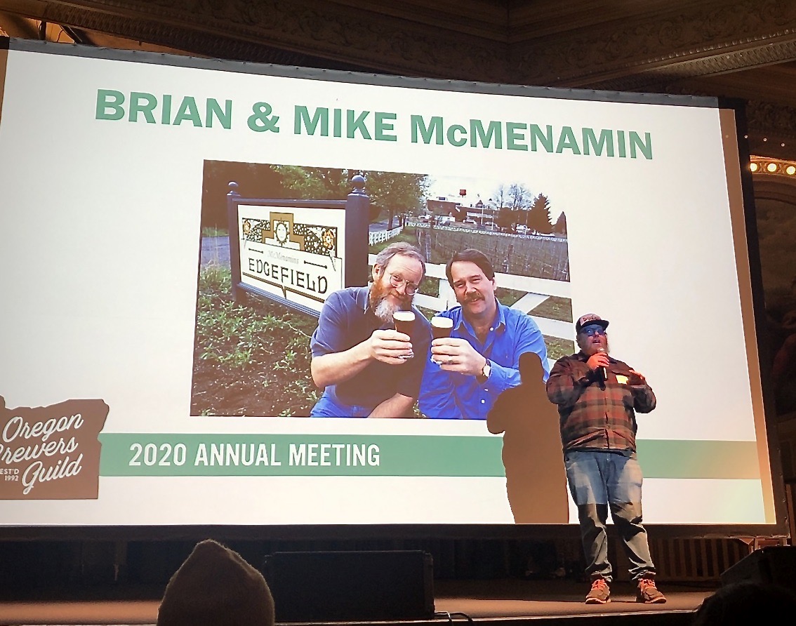 Graham Brogan presenting the Oregon Brewers Guild Lifetime Achievement Award to Brian and Mike McMenamin.