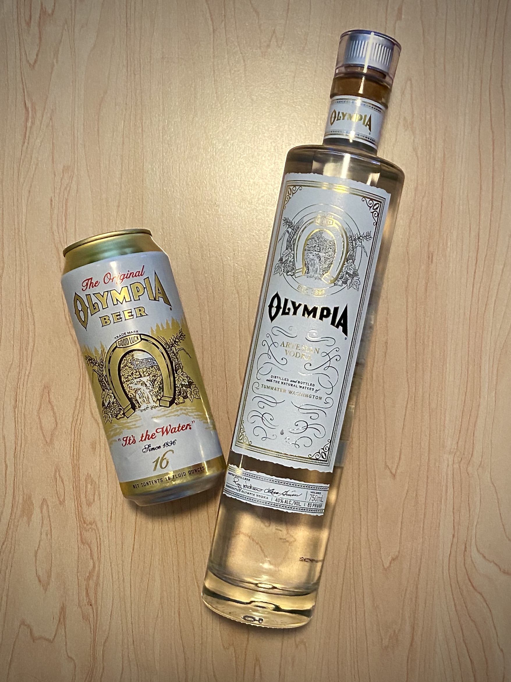 A Tallboy of Olympia Beer and the new Olympia Artesian Vodka.