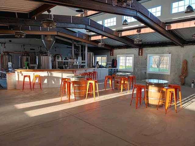 Inside the indoor portion of the tasting room at Crowing Hen Brewery. (image courtesy of Ryan Rhea at Crowning Hen Brewery)
