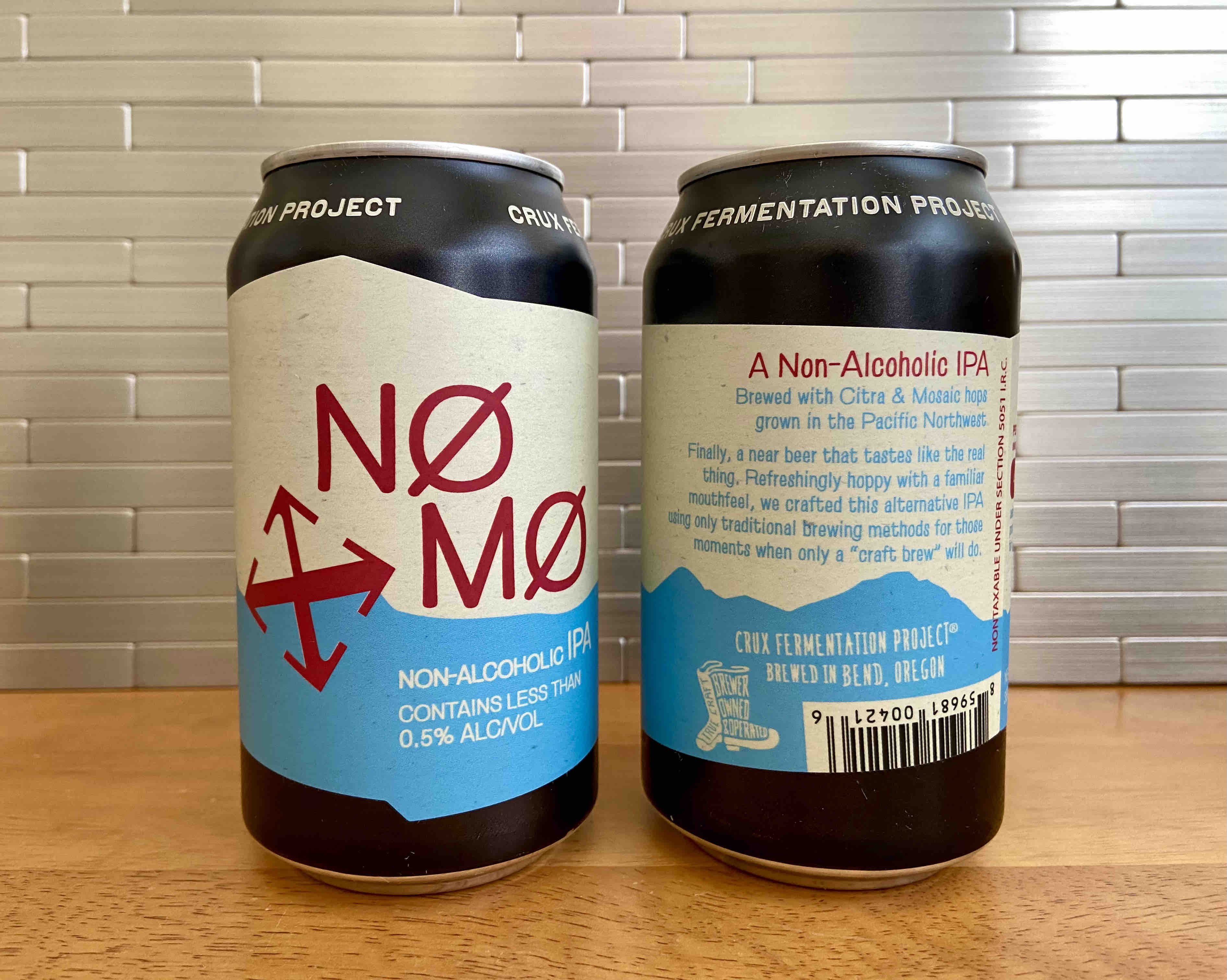 The front and rear label of NØ MØ Non-Alcoholic IPA from Crux Fermentation Project.