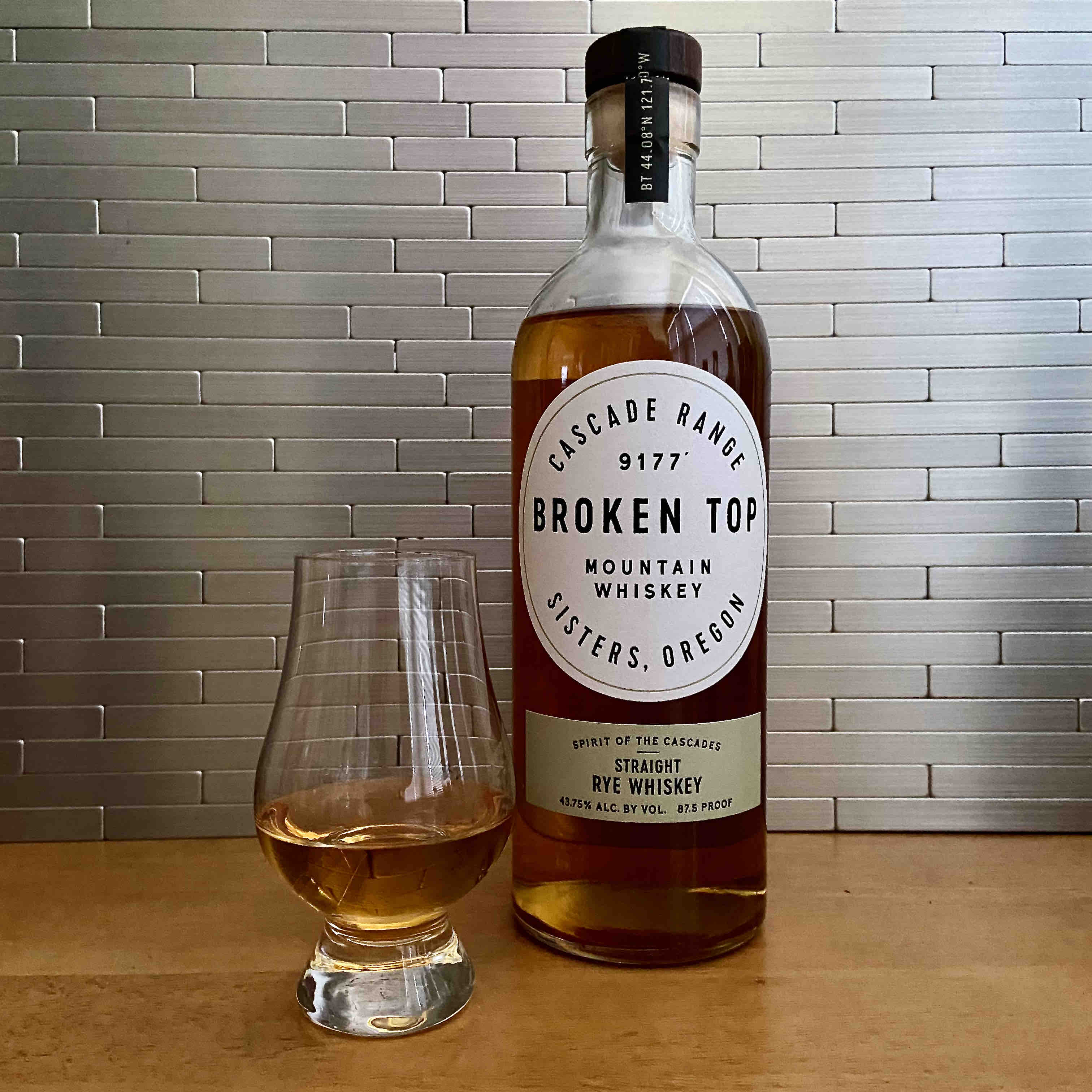 A Glencairn glass of Broken Top Straight Rye Whiskey from Sisters, Oregon.