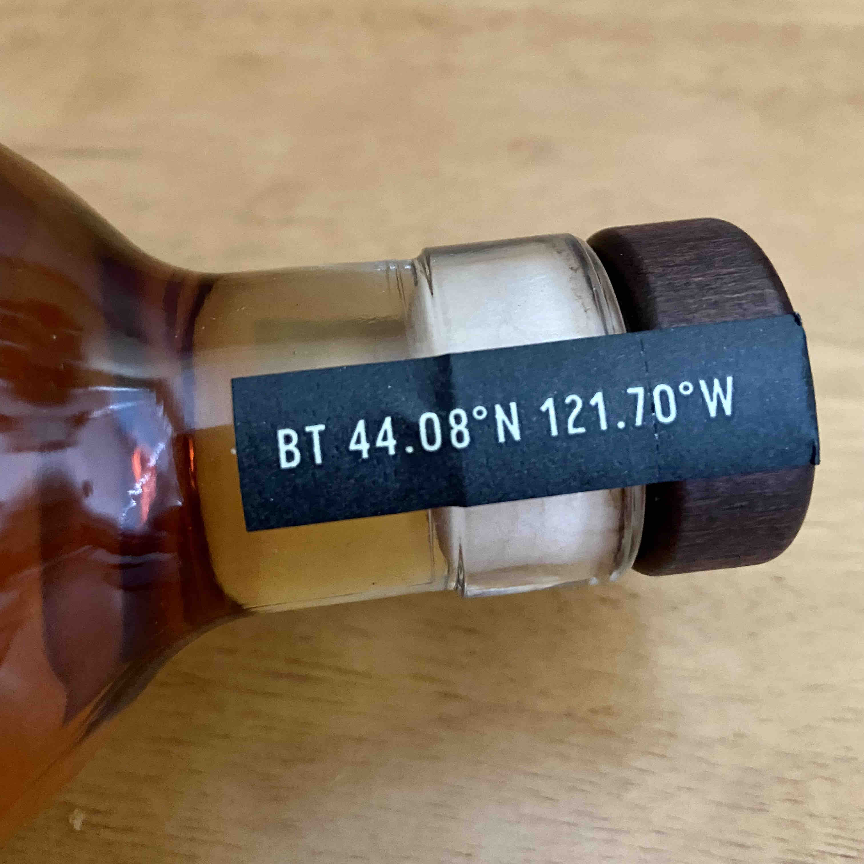 The coordinates of 44.08°N 121.70°W on the tape on the bottle of Broken Top Straight Rye Whiskey lead to Broken Top outside of Sisters, Oregon.
