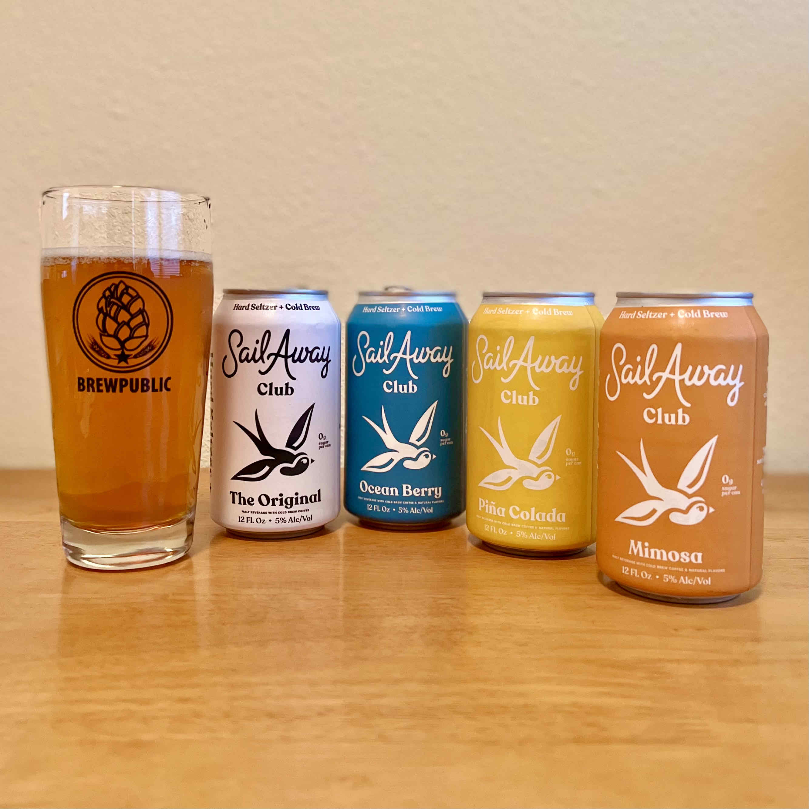 The lineup of Sail Away Coffee Co. Hard Seltzer x Cold Brew in four flavors - The Original, Ocean Berry, Pina Colada, and Mimosa.