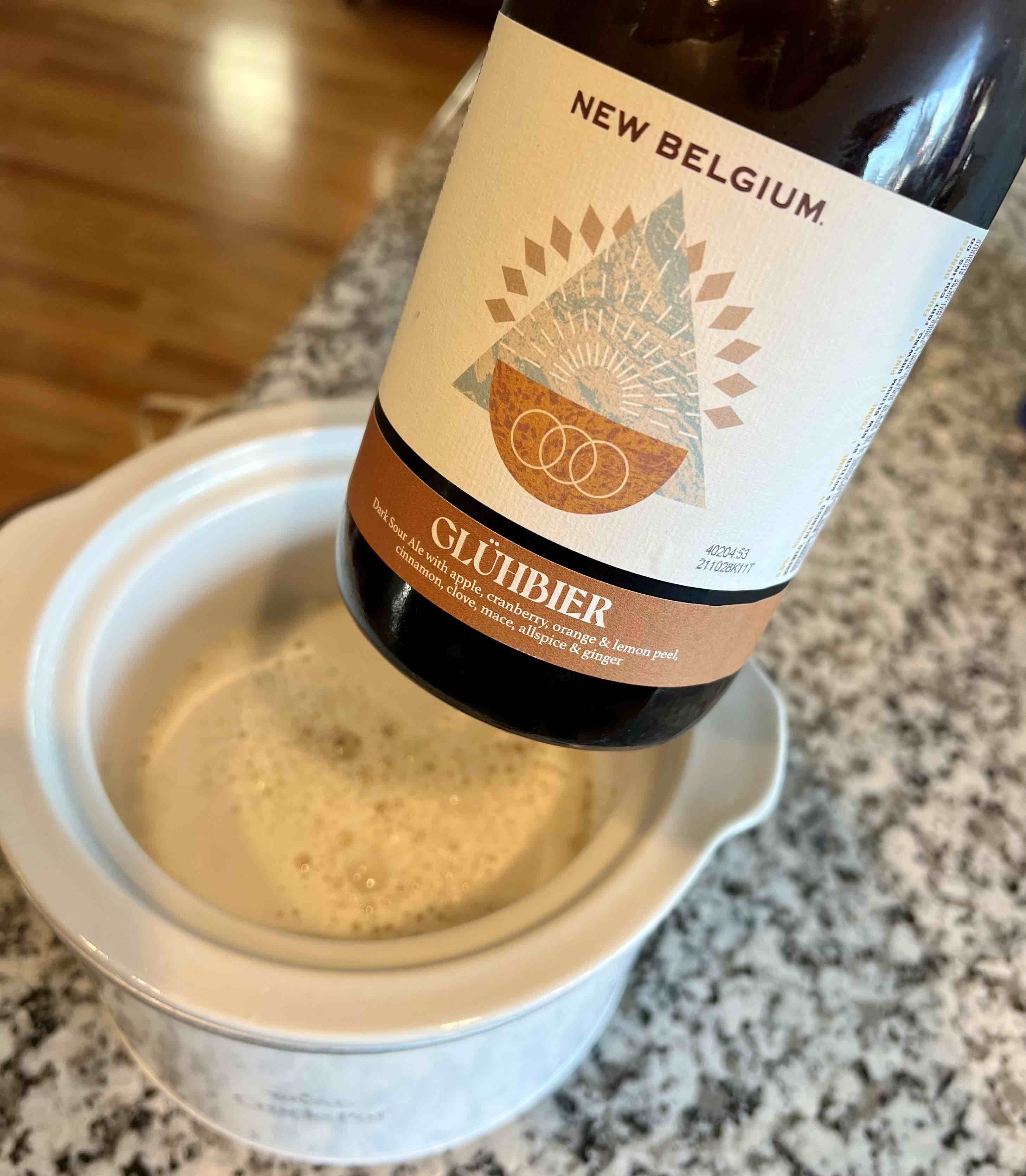 Adding the New Belgium Brewing Glühbier to the crockpot for a bit of warming.