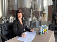 Linda Cooley, CEO at Mad River Brewery, signs the contract with the San Francisco Giants to be one of the park's craft beer suppliers. (Image courtesy of Mad River Brewery)