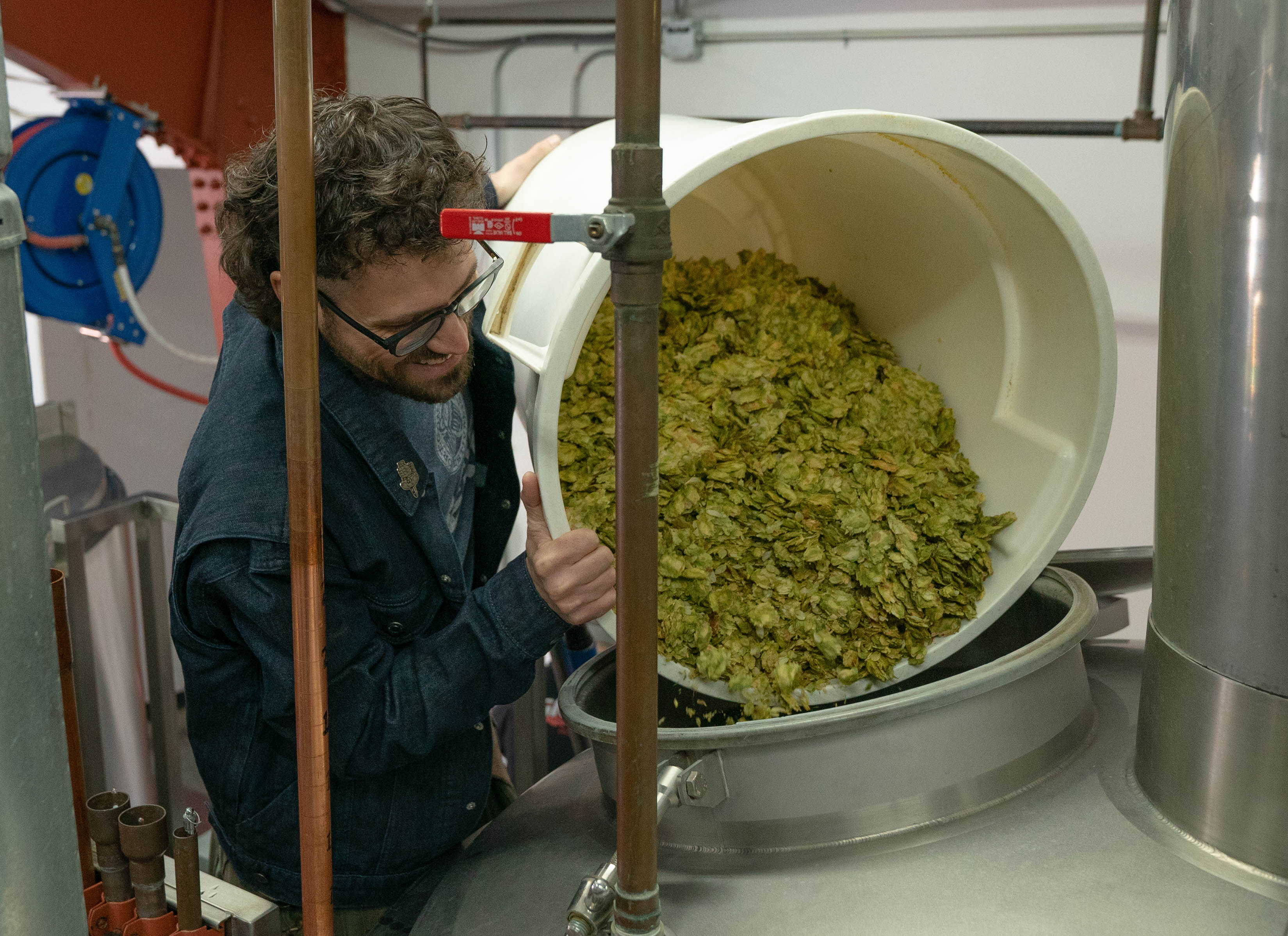 The Unipiper adding hops during brew day at Gigantic Brewing. (image courtesy of Gigantic Brewing)