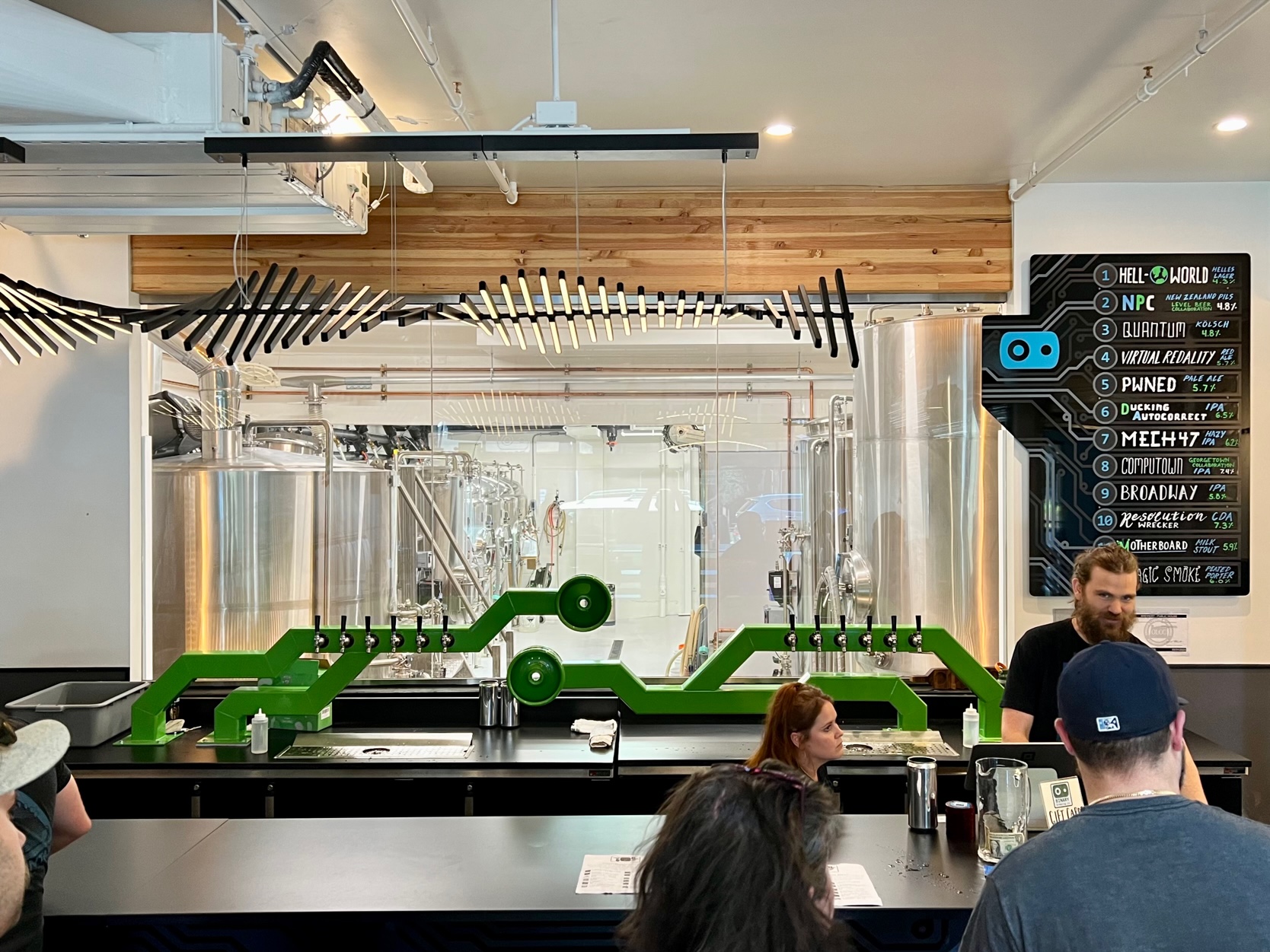 Behind the bar at Binary Brewing sits the newly installed 10-barrel brewhouse.