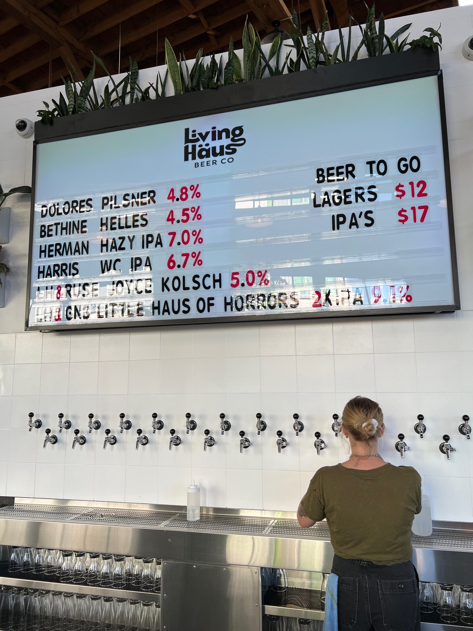 The easy to read beer menu board at Living Haüs Beer Co.