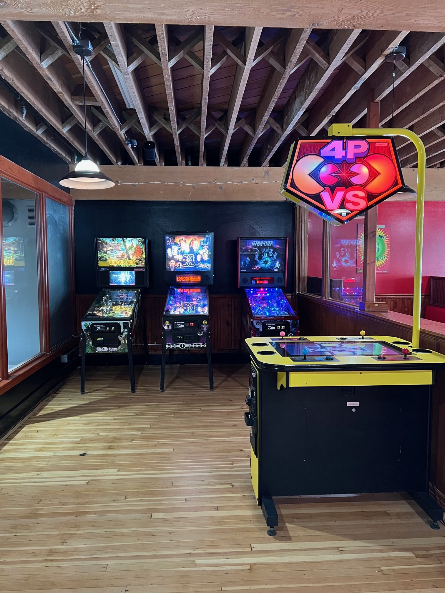 Three pinball machines and a four person Pac-Man in the new gaming area.