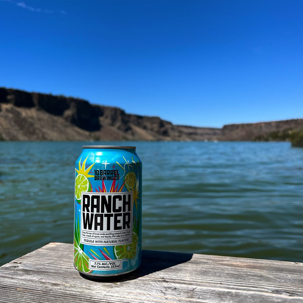 A can of 10 Barrel Ranch Water with Lake Billy Chinook in the background.
