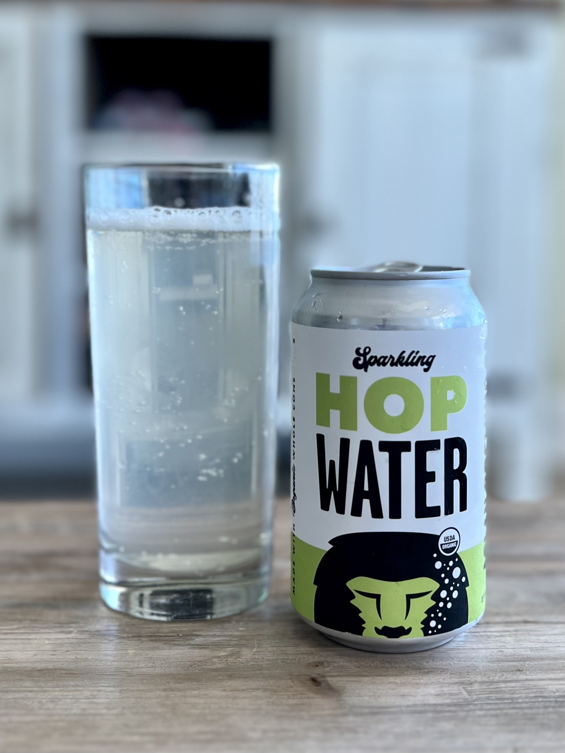 A refreshing glass of Sparkling Hop Water from Aslan Brewing.
