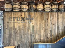 Former onion crates are now part of the wood panels on the walls at the Crux Portland Pub.